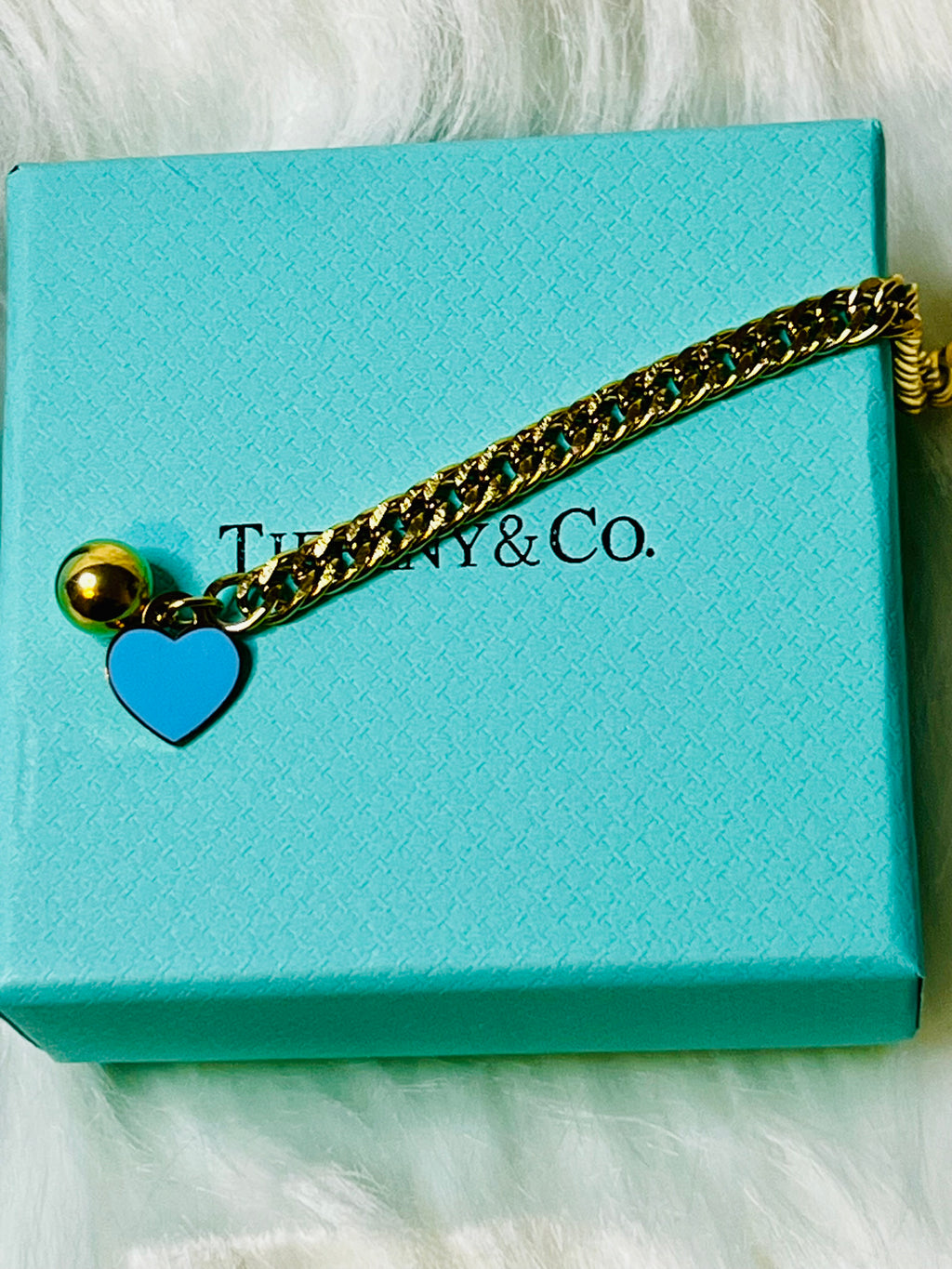 Tiffany & Co. Iconic Please Return to Tiffany Gold Woven Bracelet with Heart Shaped Blue & Gold Ball Dangle