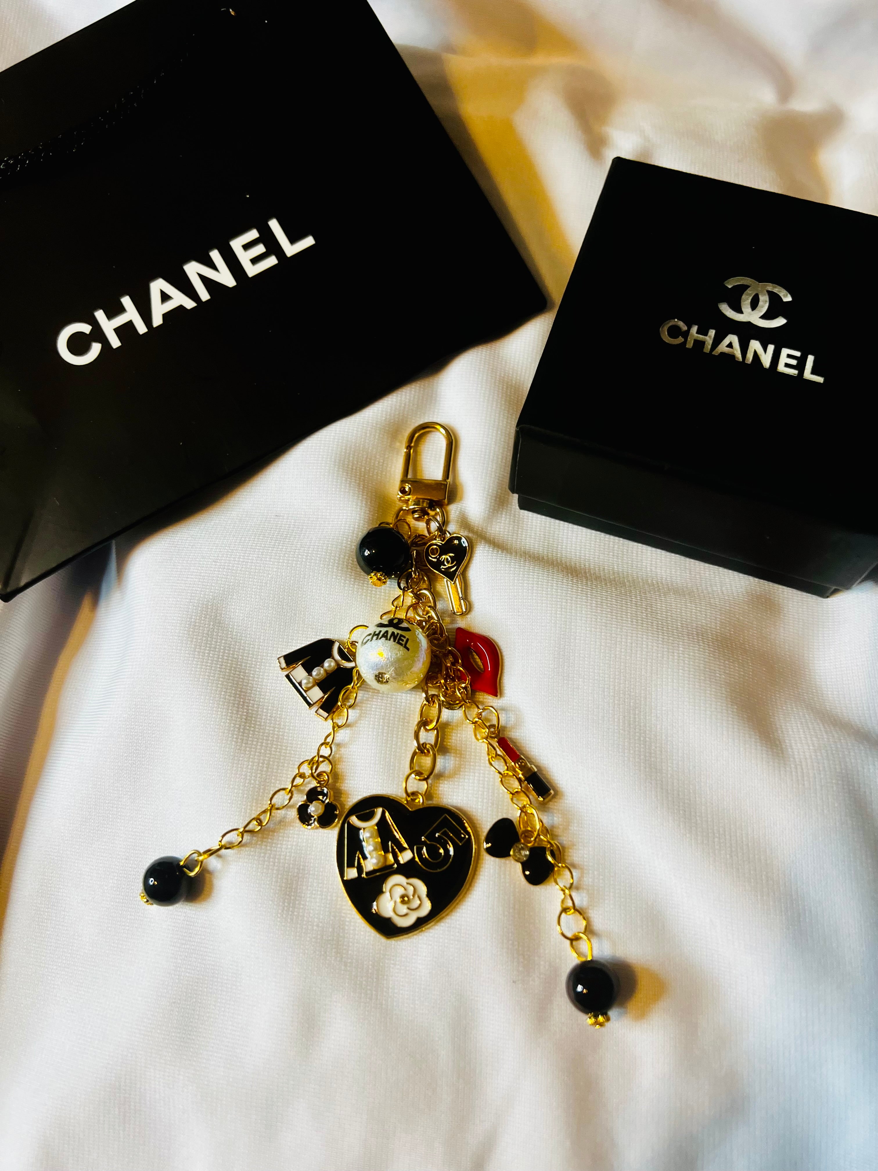 CHANEL Gold Keychain with Black Charms