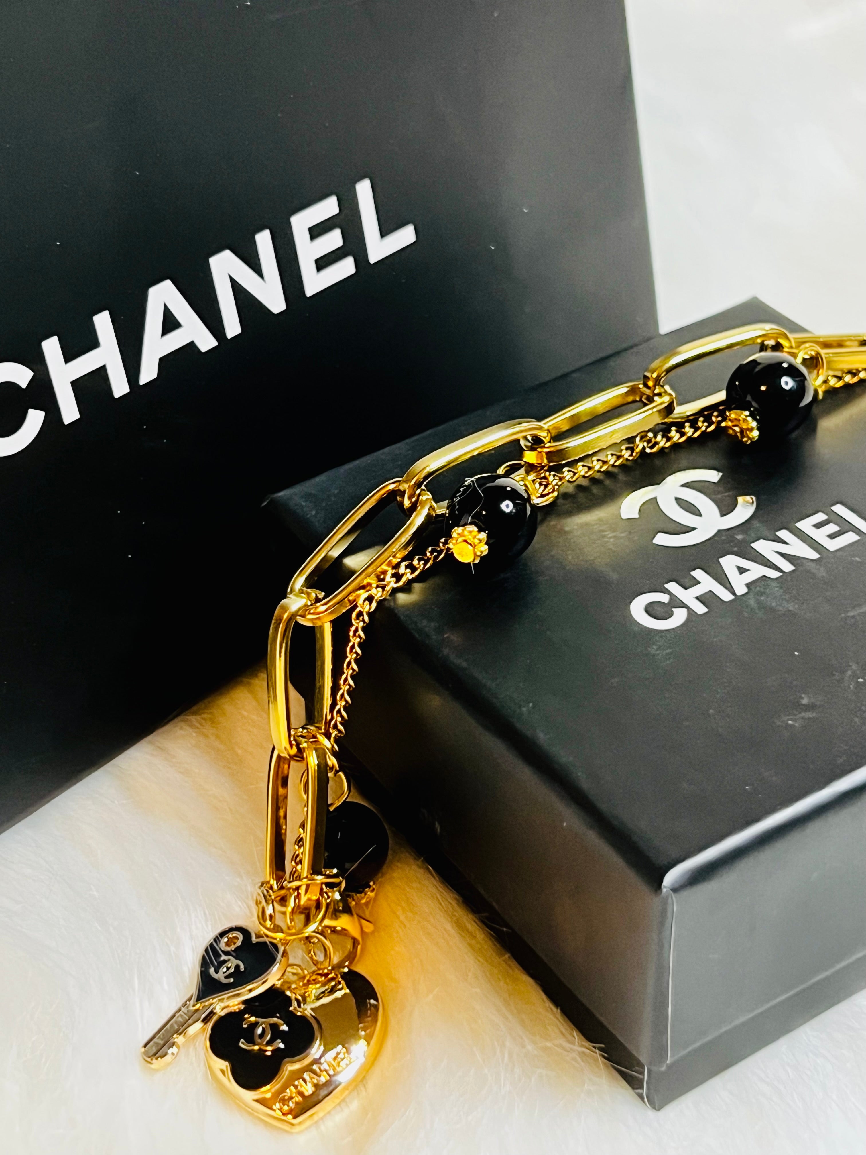 CHANEL Gold & Black Charm Chain Bracelet Heart Dangle