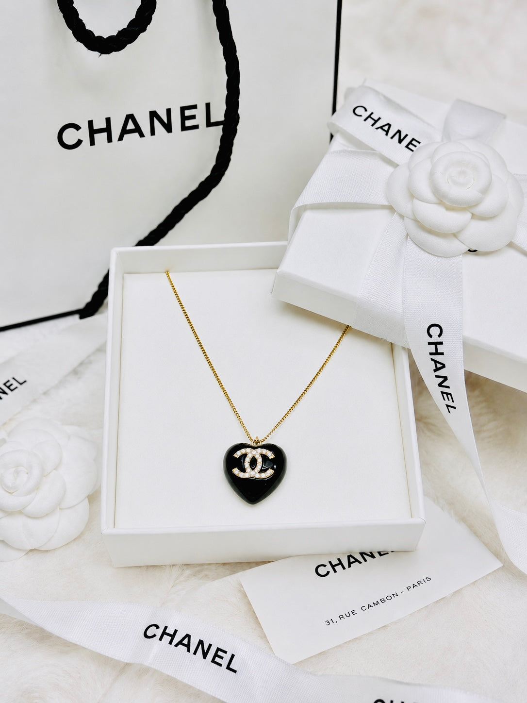 CHANEL Black Stone with Gold Lettering Heart Pendant Necklace
