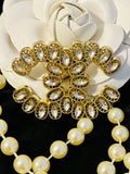 CHANEL Gold with Crystal Accent Brooch Featuring a Unique Design  I