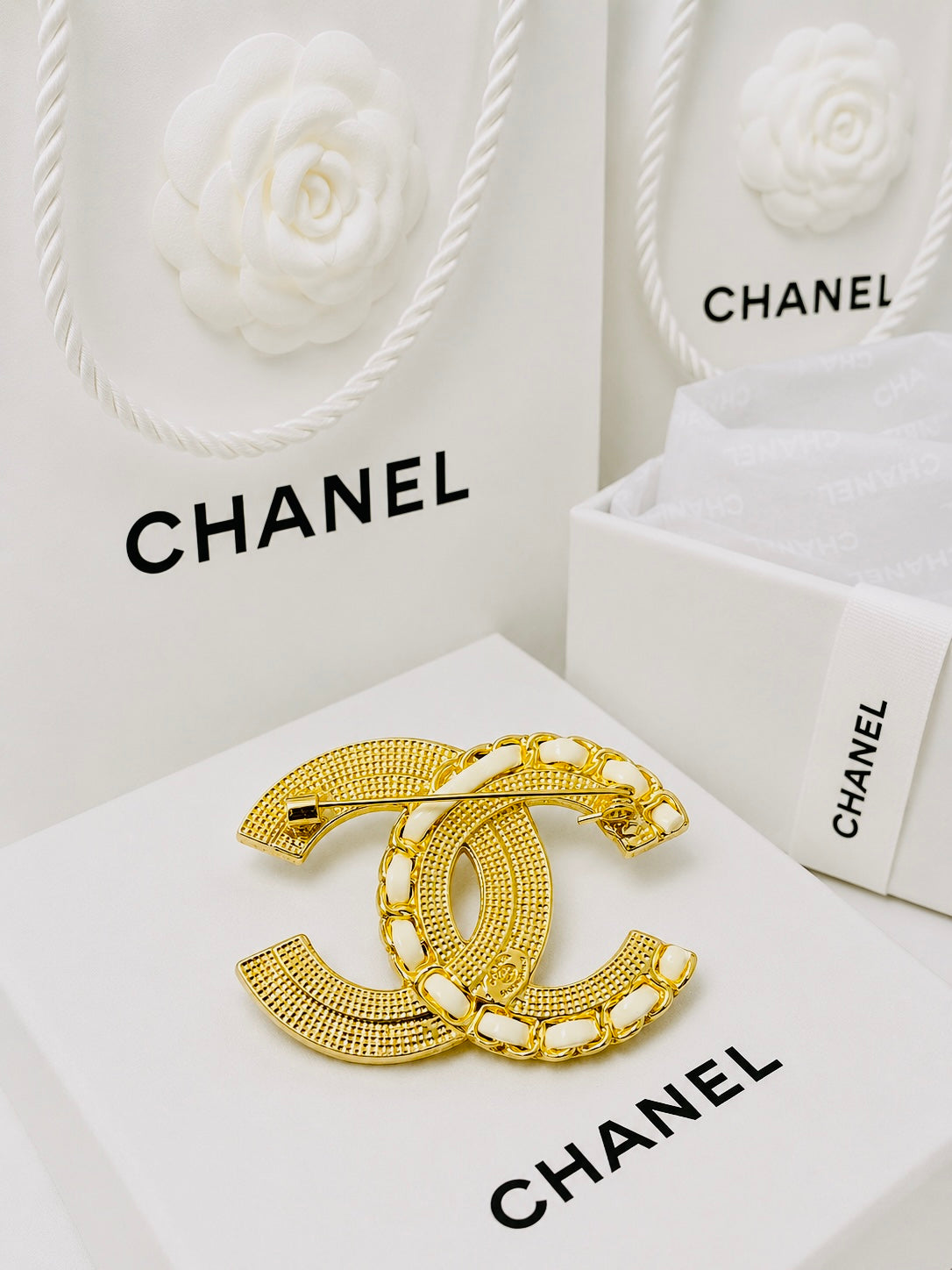 CHANEL Gold & White Leather Braid with Rhinestones Brooch