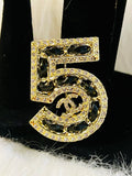 Iconic CHANEL NO 5 Gold with Rhinestone Accent Black Braided Brooch