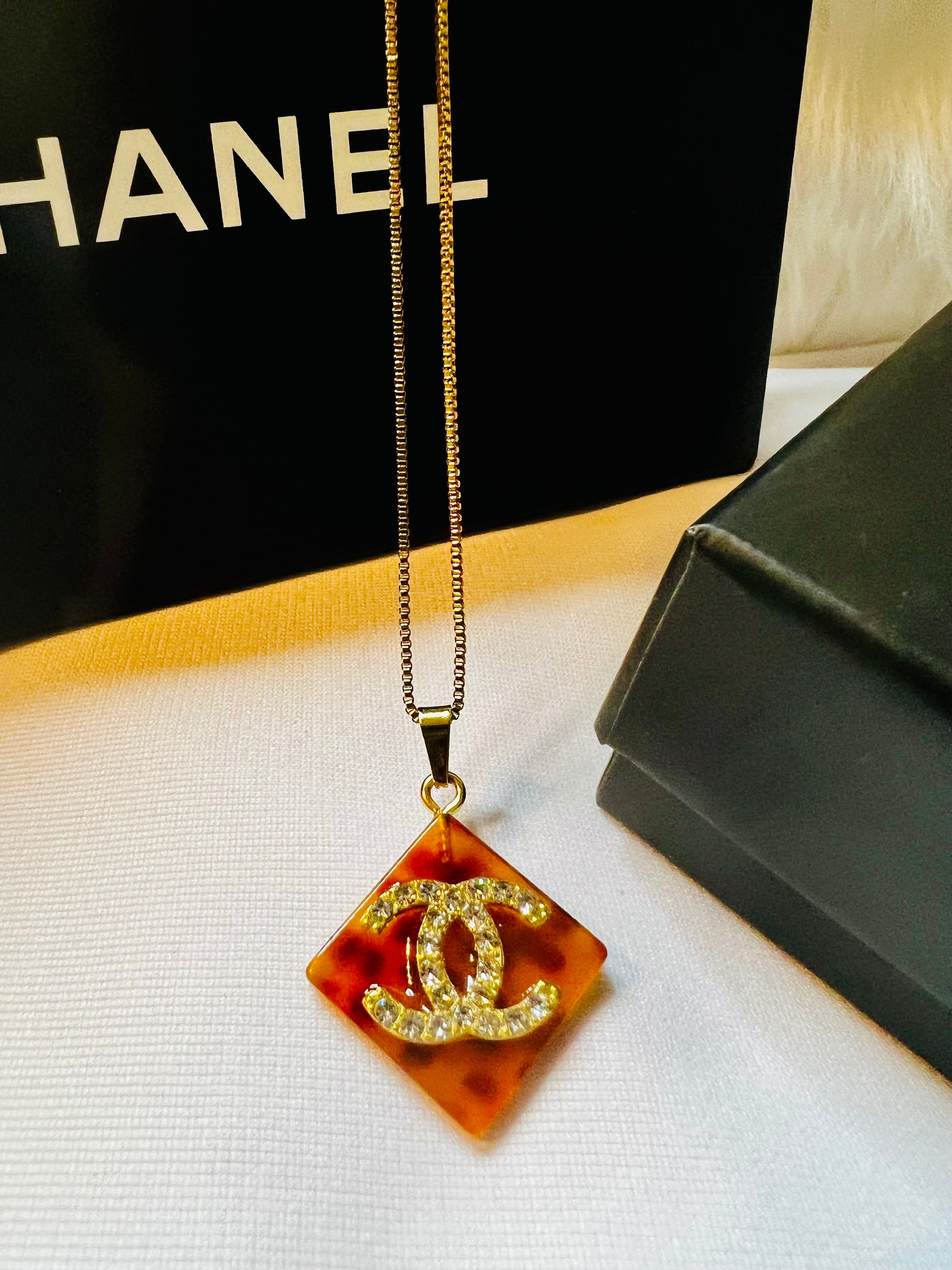 CHANEL Cheetah Print with Gold Lettering Diamond Pendant Necklace