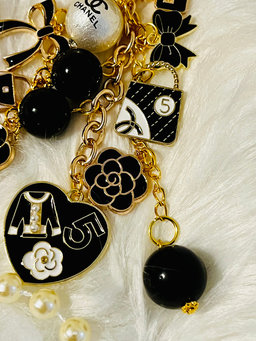 Chanel inspired black pearl bag charm-gold multi-charm with no 5 heart, camellia, bow-styled on classic flap