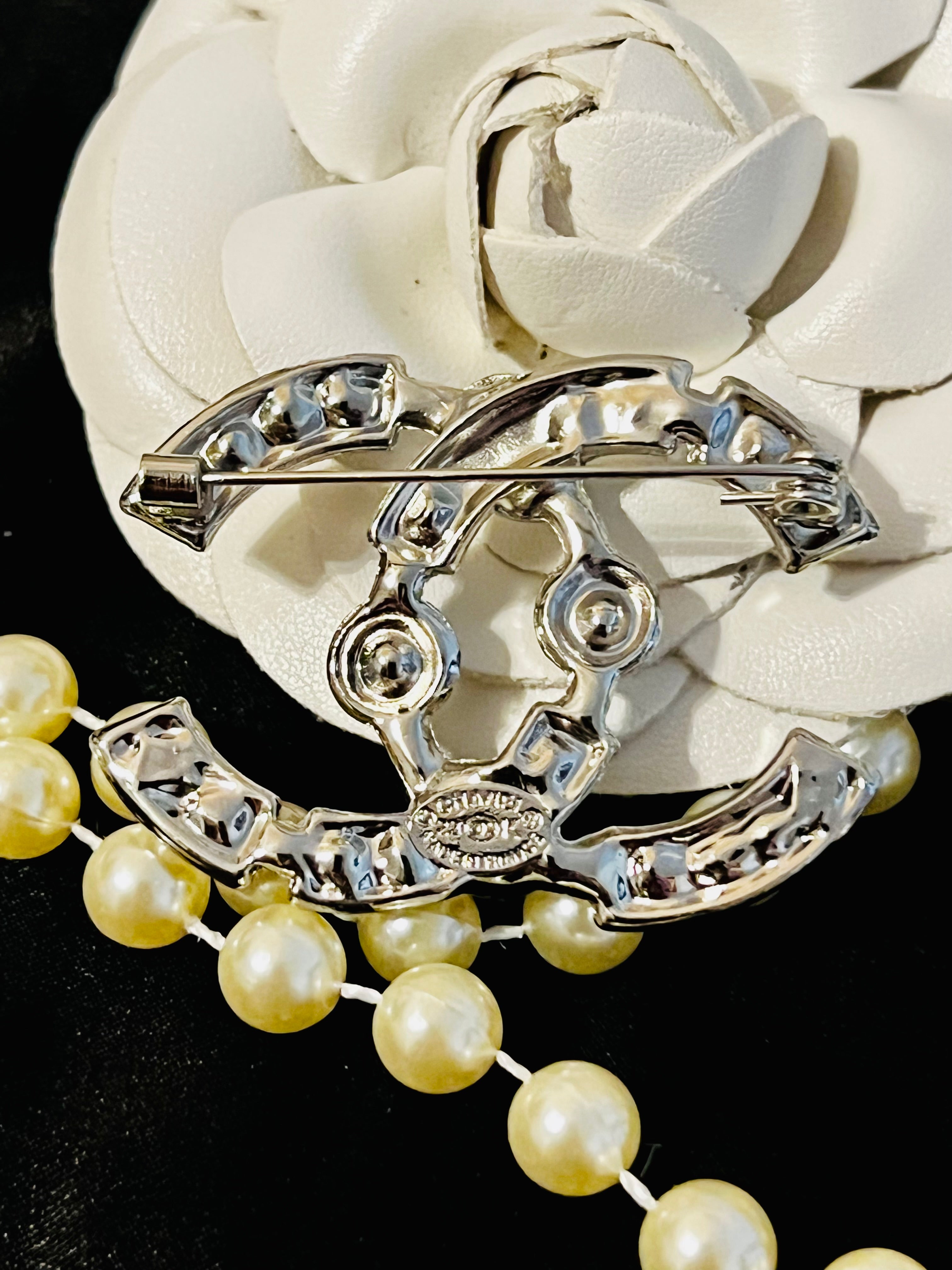 CHANEL Silver with Rhinestone Accent Brooch