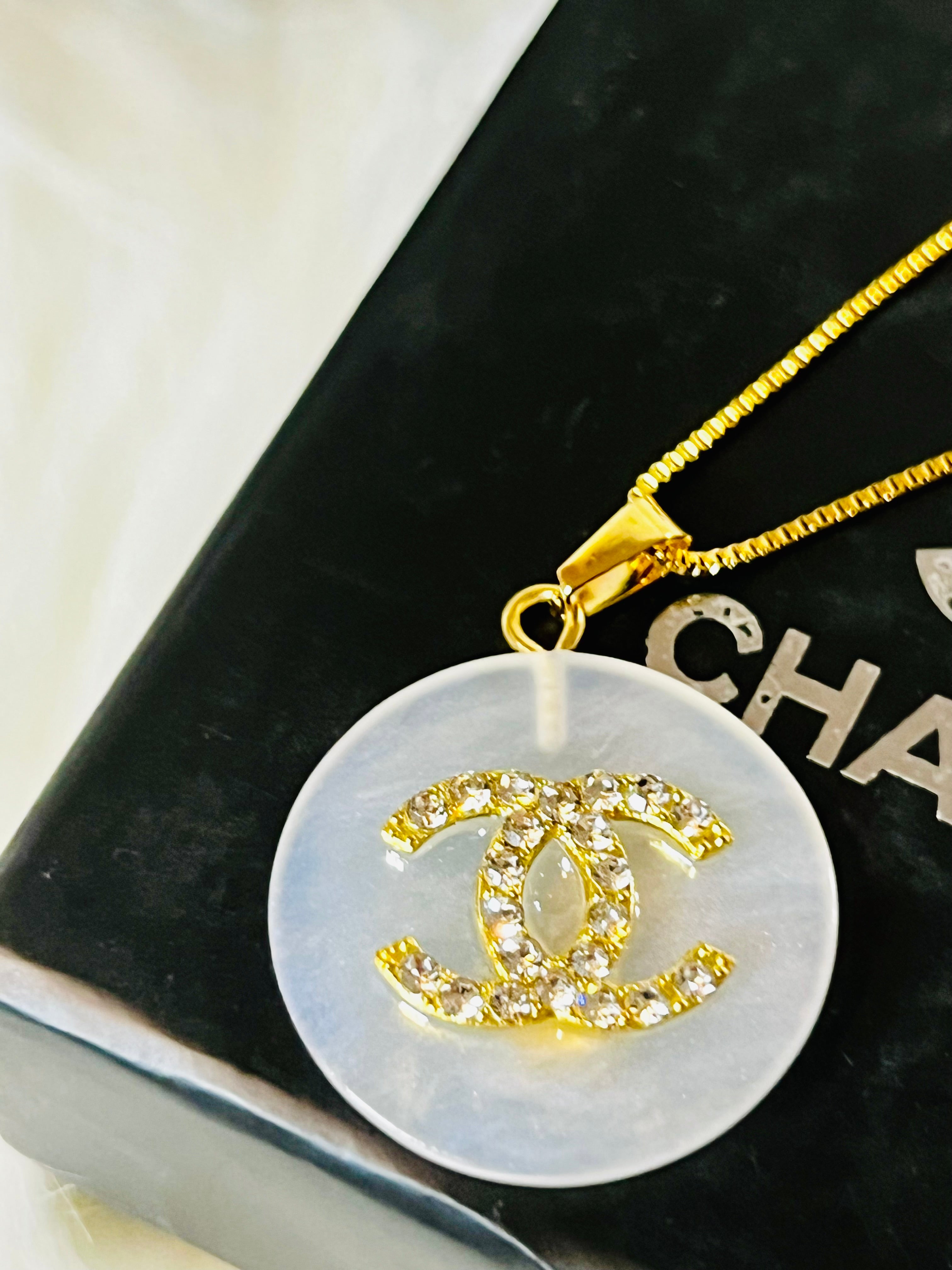 CHANEL White Shell with Gold Lettering Circular Pendant Necklace