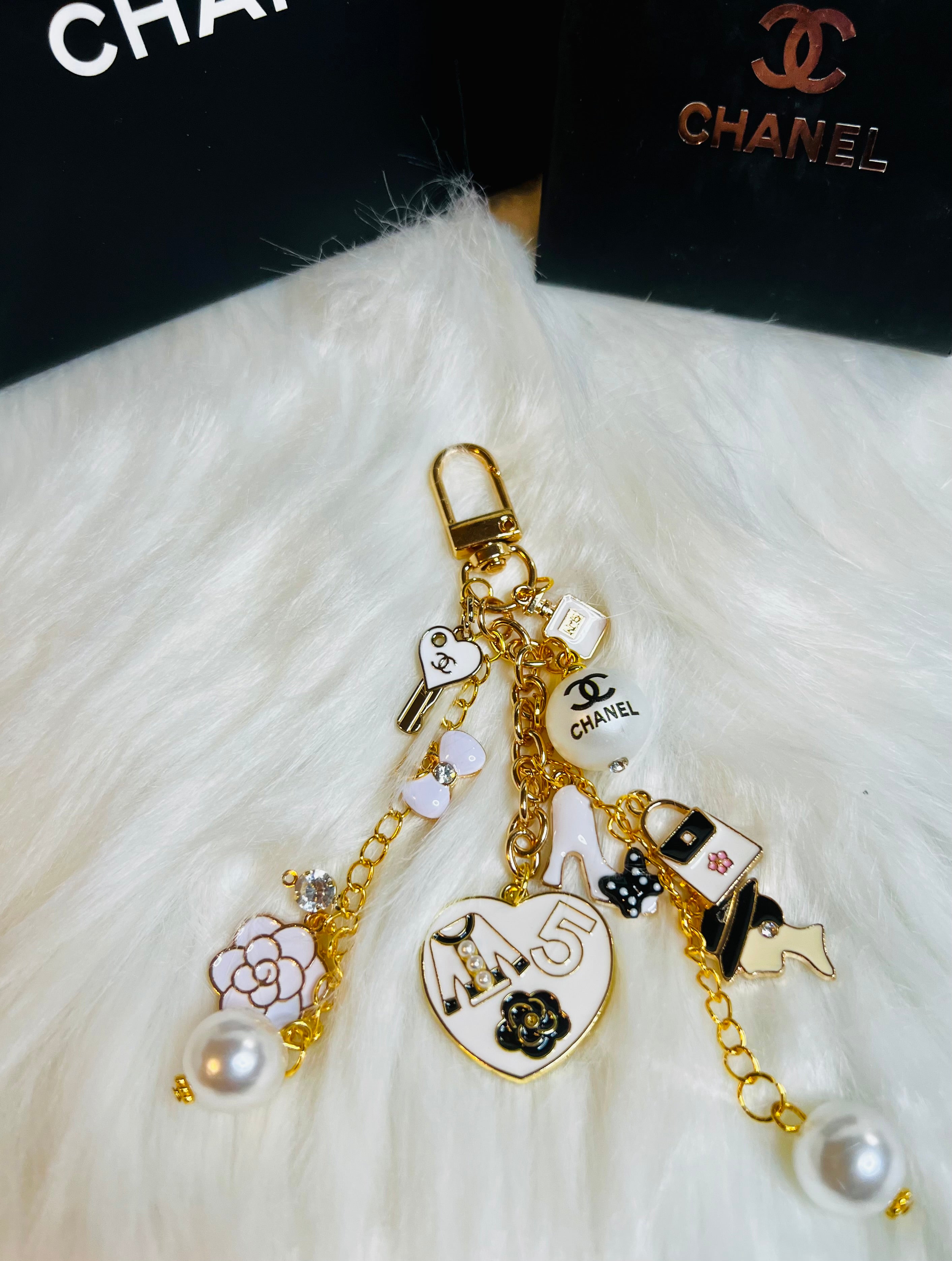 CHANEL Gold, White, and Black Pearl Logo Charm Keychain