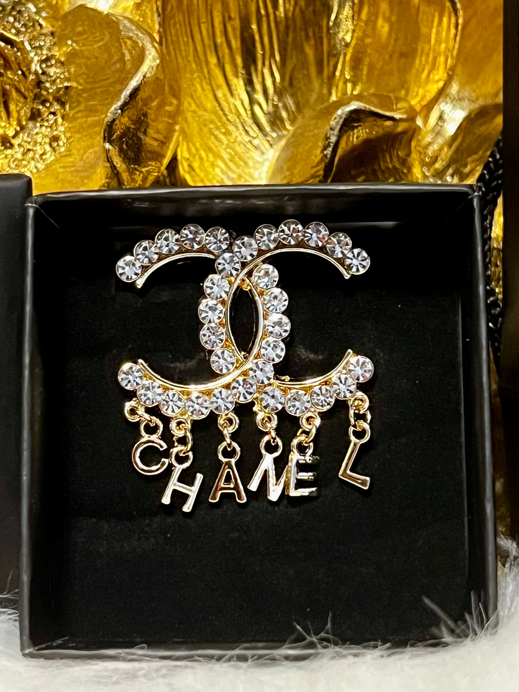 CHANEL Unique Brooch Featuring Gold Crystal Accents with Iconic Drop Logo A