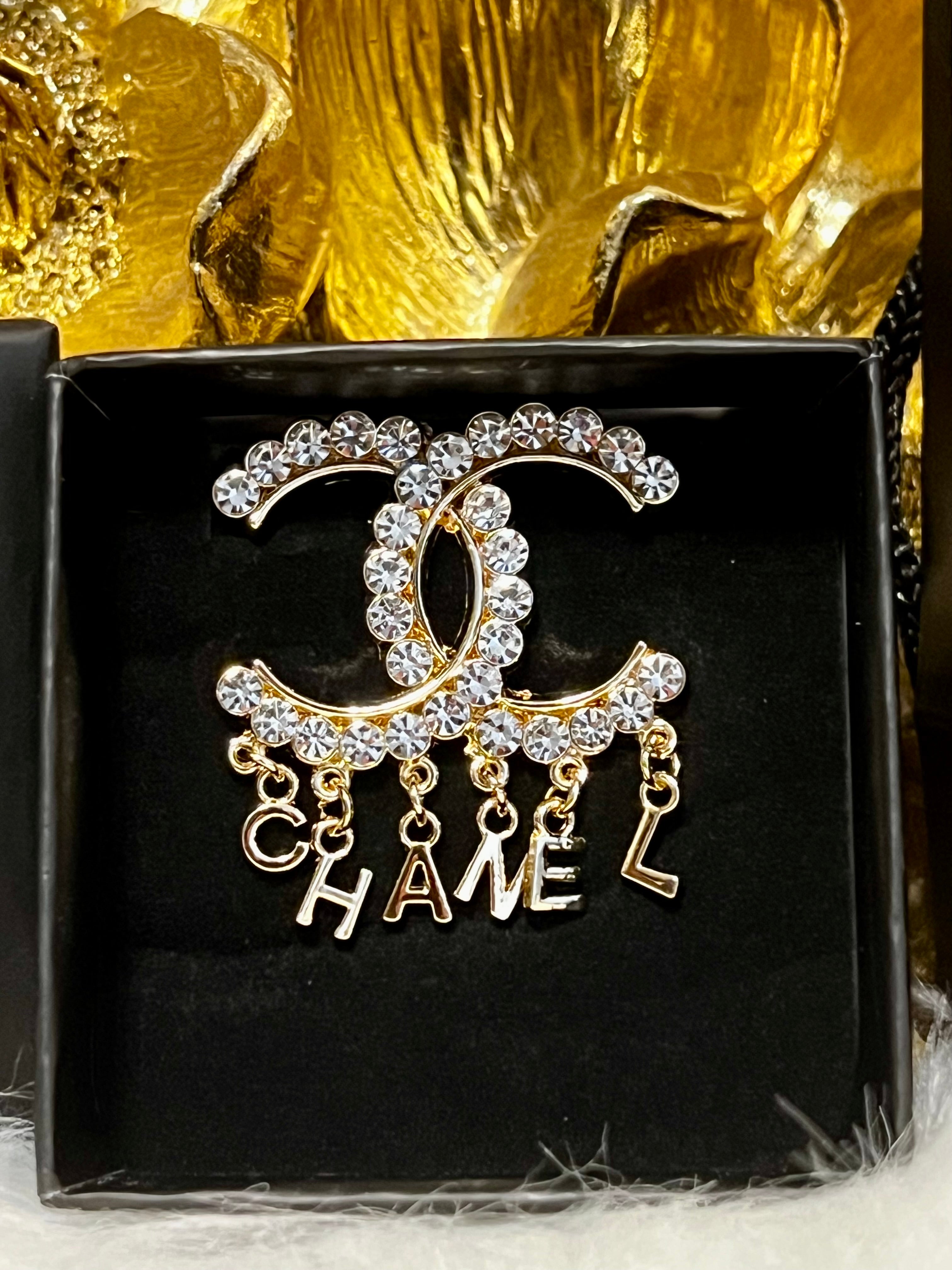 CHANEL Unique Brooch Featuring Gold Crystal Accents with Iconic Drop Logo A
