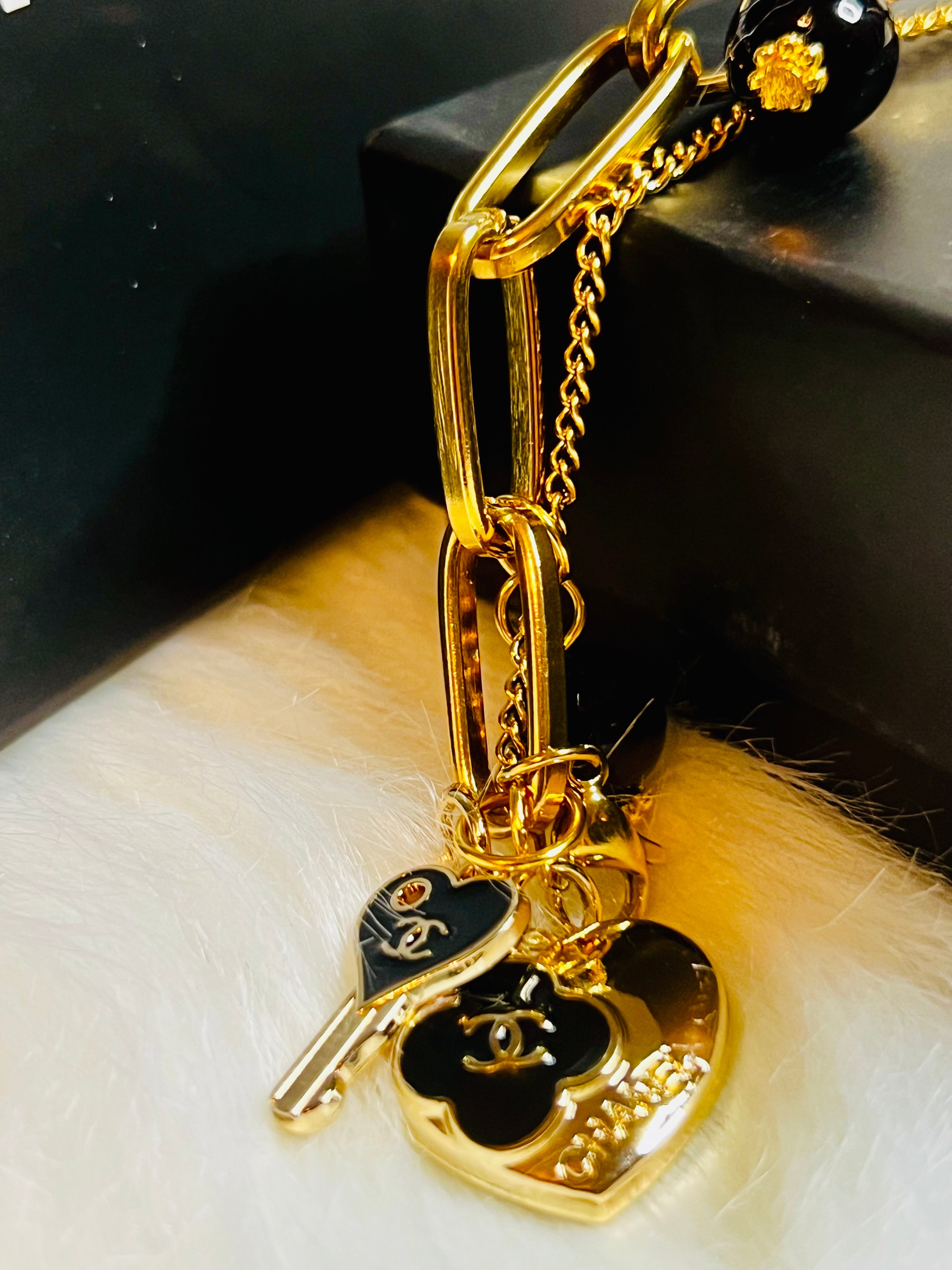 CHANEL Gold & Black Charm Chain Bracelet Heart Dangle