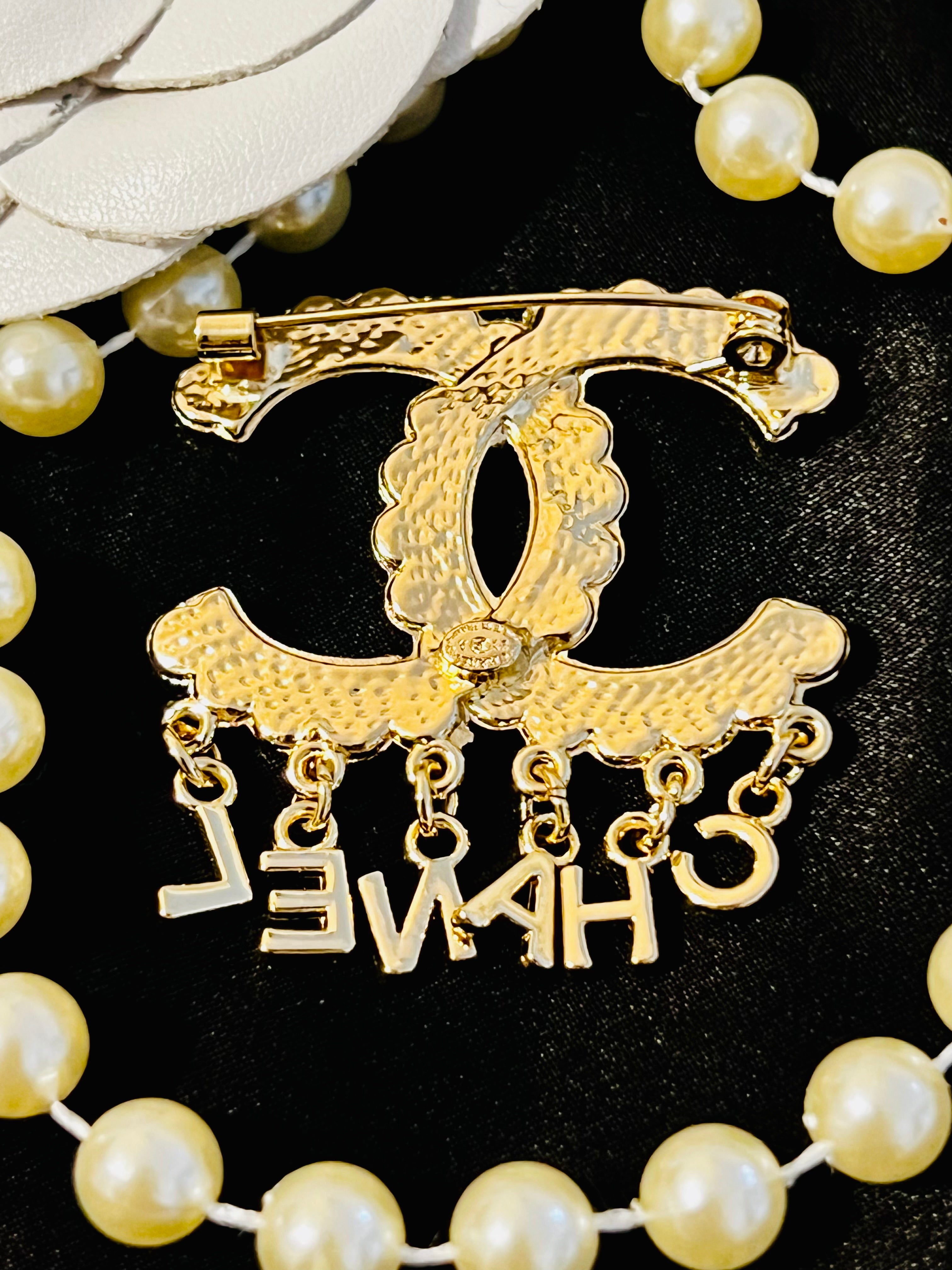 CHANEL Unique Brooch Featuring Gold Crystal Accents with Iconic Drop Logo A