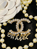 CHANEL Unique Brooch Featuring Gold Crystal Accents with Iconic Drop Logo A