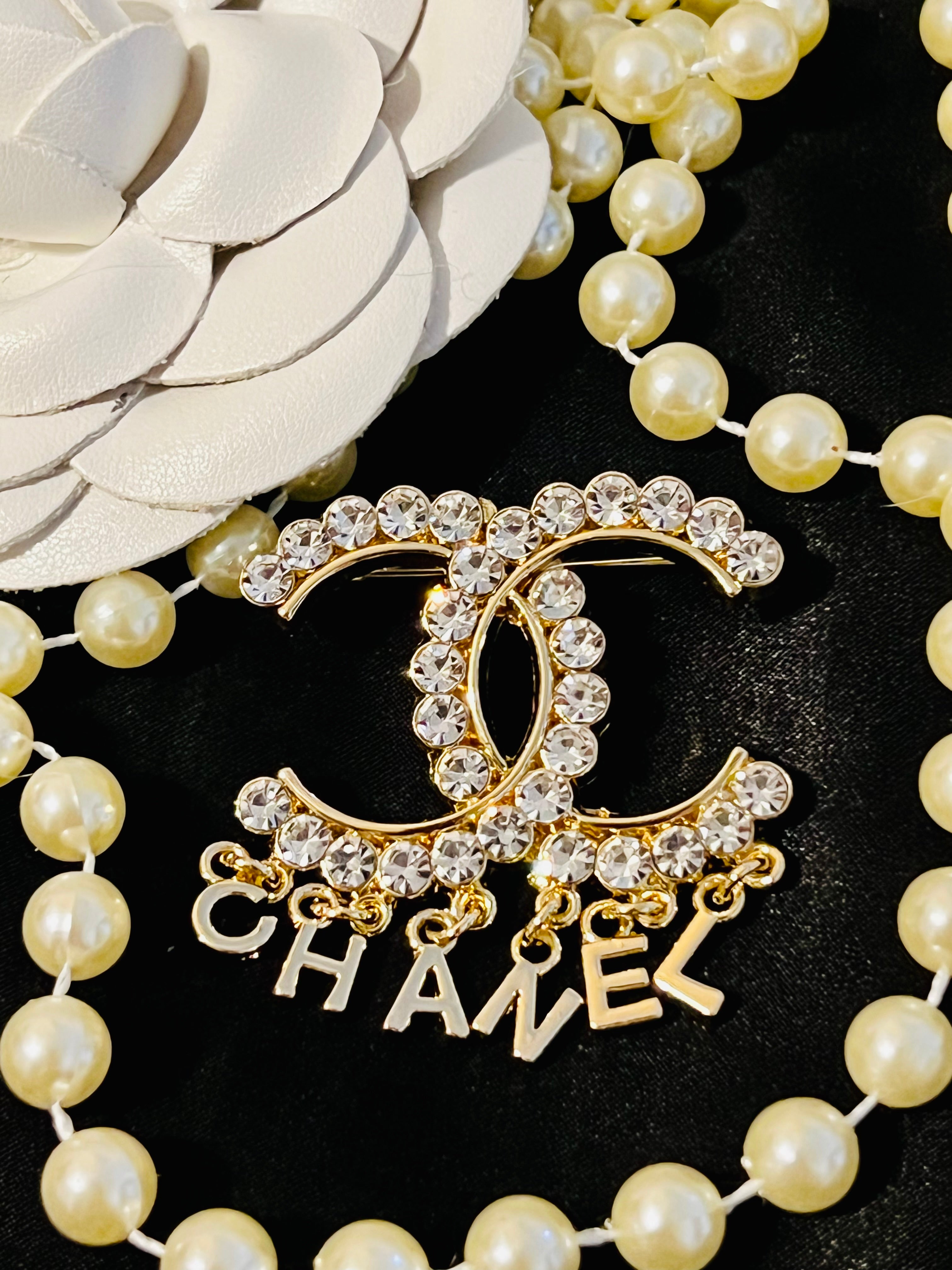 CHANEL Unique Brooch Featuring Gold Crystal Accents with Iconic Drop Logo A