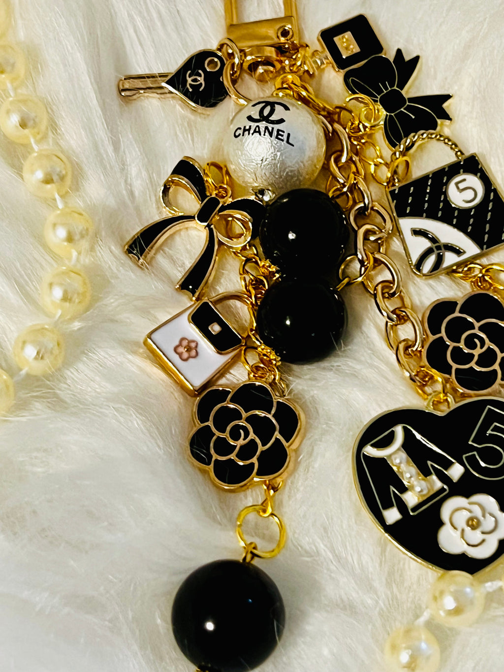 Chanel inspired black pearl bag charm-gold multi-charm with no 5 heart, camellia, bow-styled on classic flap