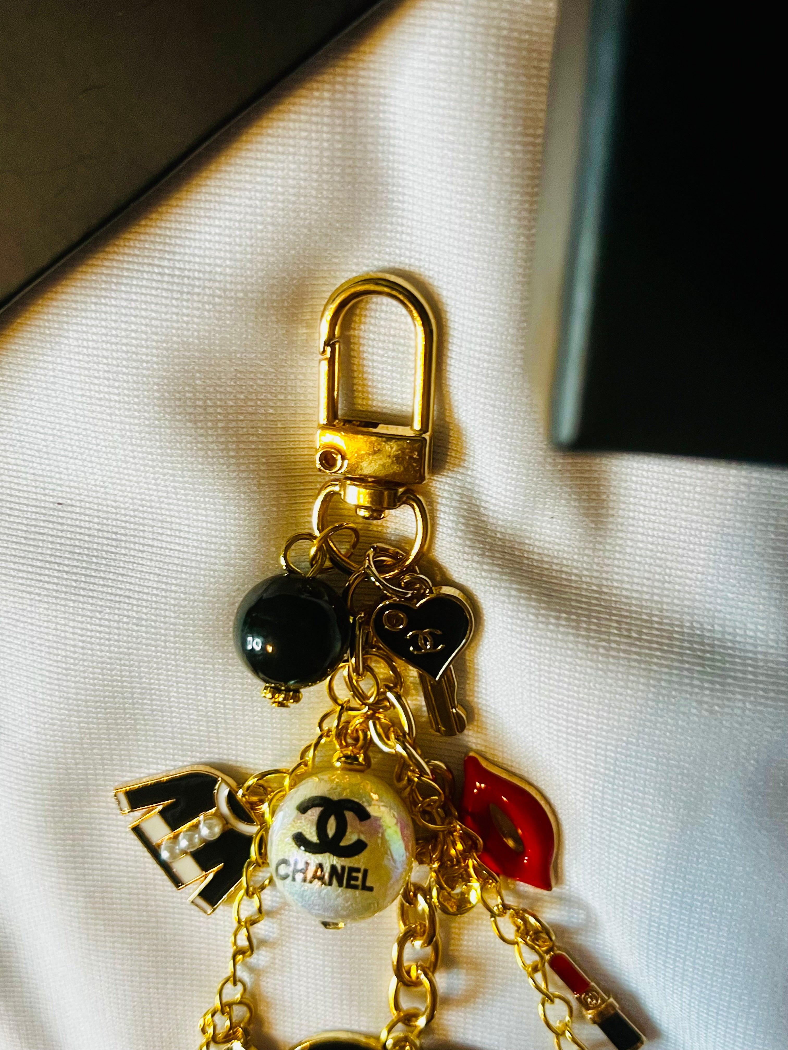 CHANEL Gold Keychain with Black Charms