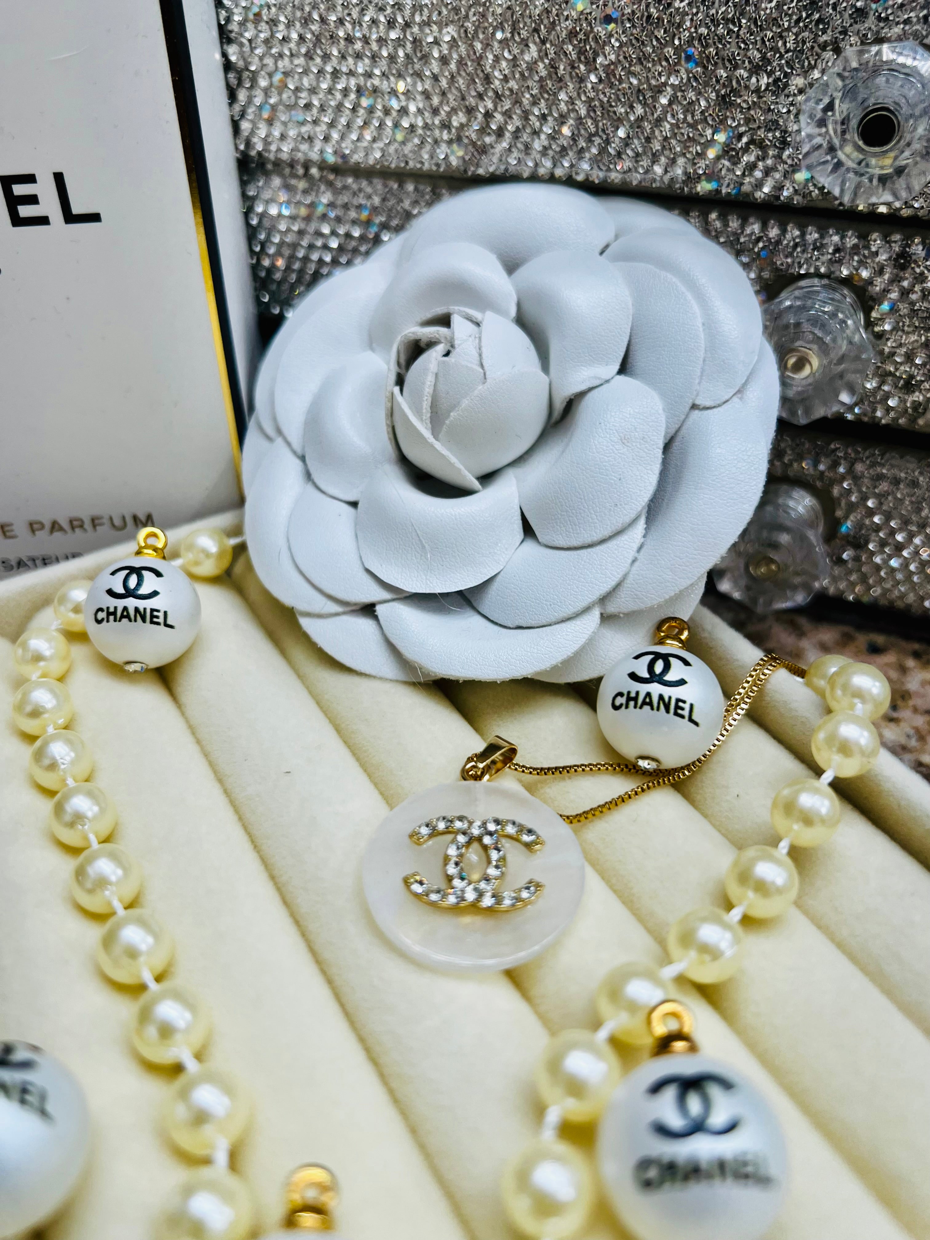 CHANEL White Shell with Gold Lettering Circular Pendant Necklace
