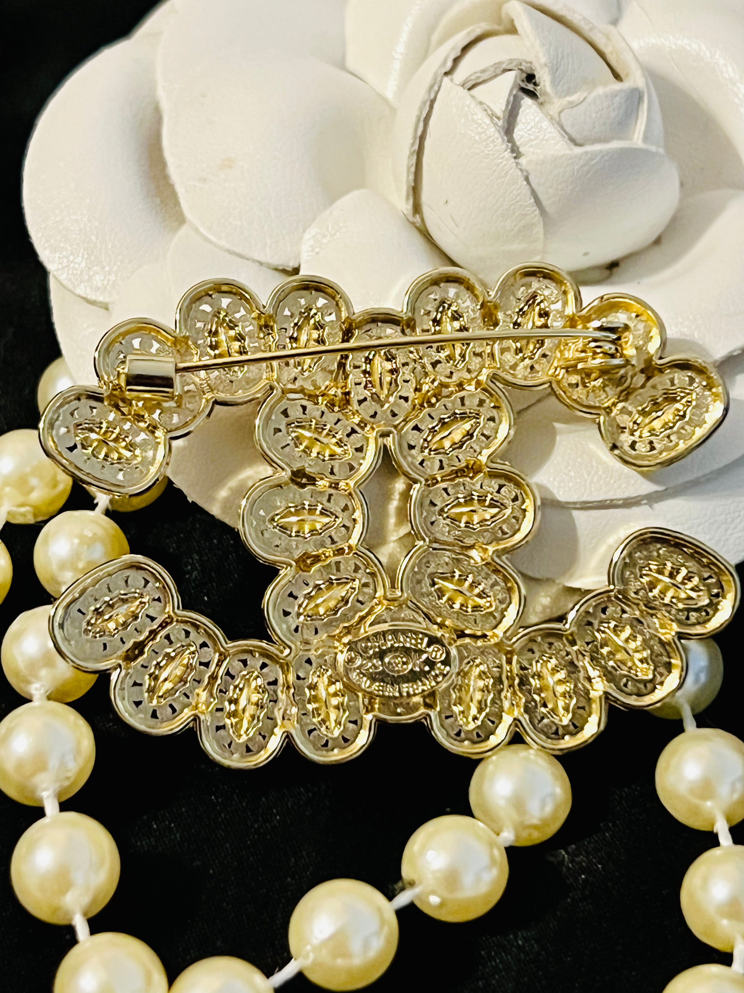 CHANEL Gold with Crystal Accent Brooch Featuring a Unique Design  I
