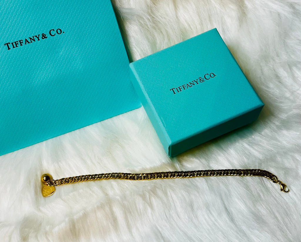 Tiffany & Co. Iconic Please Return to Tiffany Gold Woven Bracelet with Heart Shaped Blue & Gold Ball Dangle