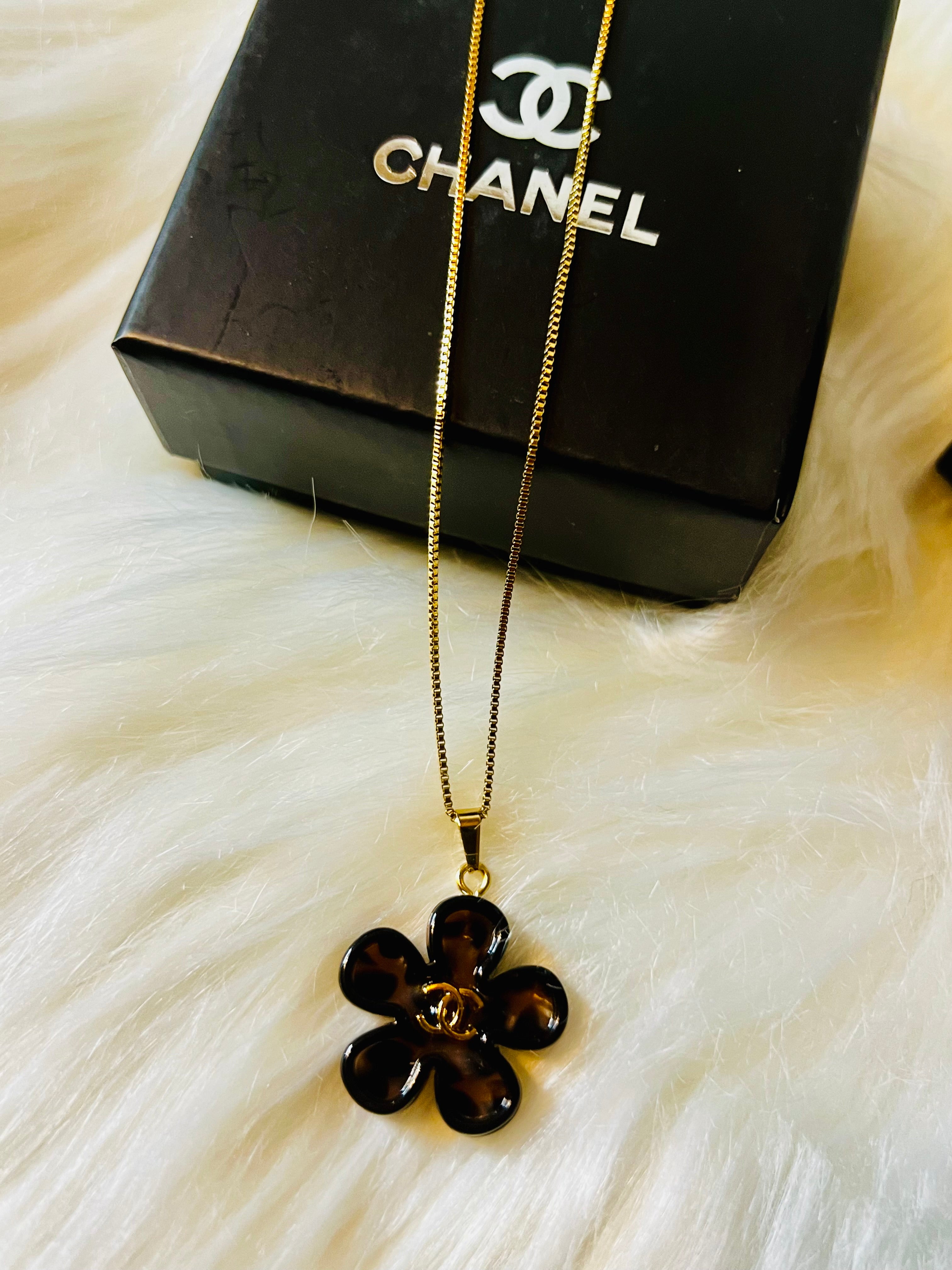 CHANEL Cheetah Print with Gold Lettering Flower Style Pendant Necklace
