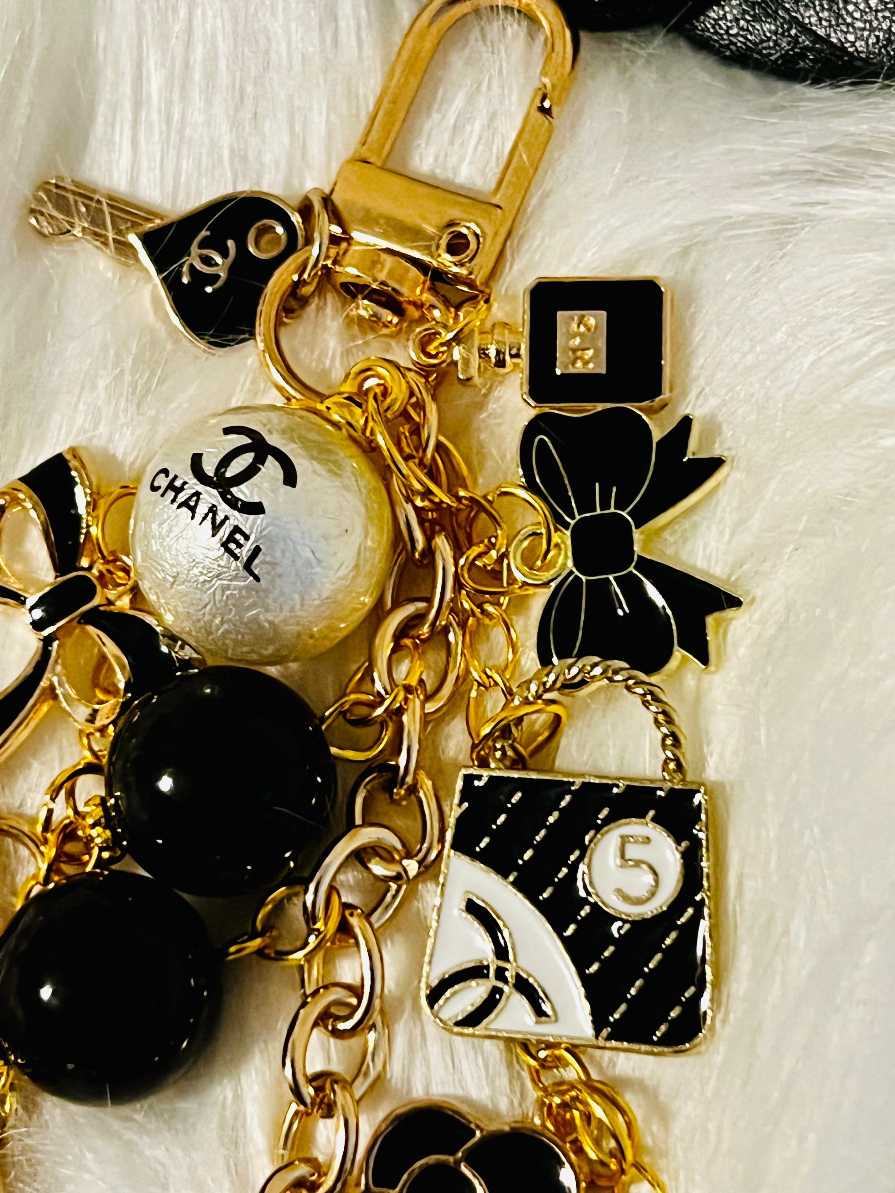 Chanel inspired black pearl bag charm-gold multi-charm with no 5 heart, camellia, bow-styled on classic flap