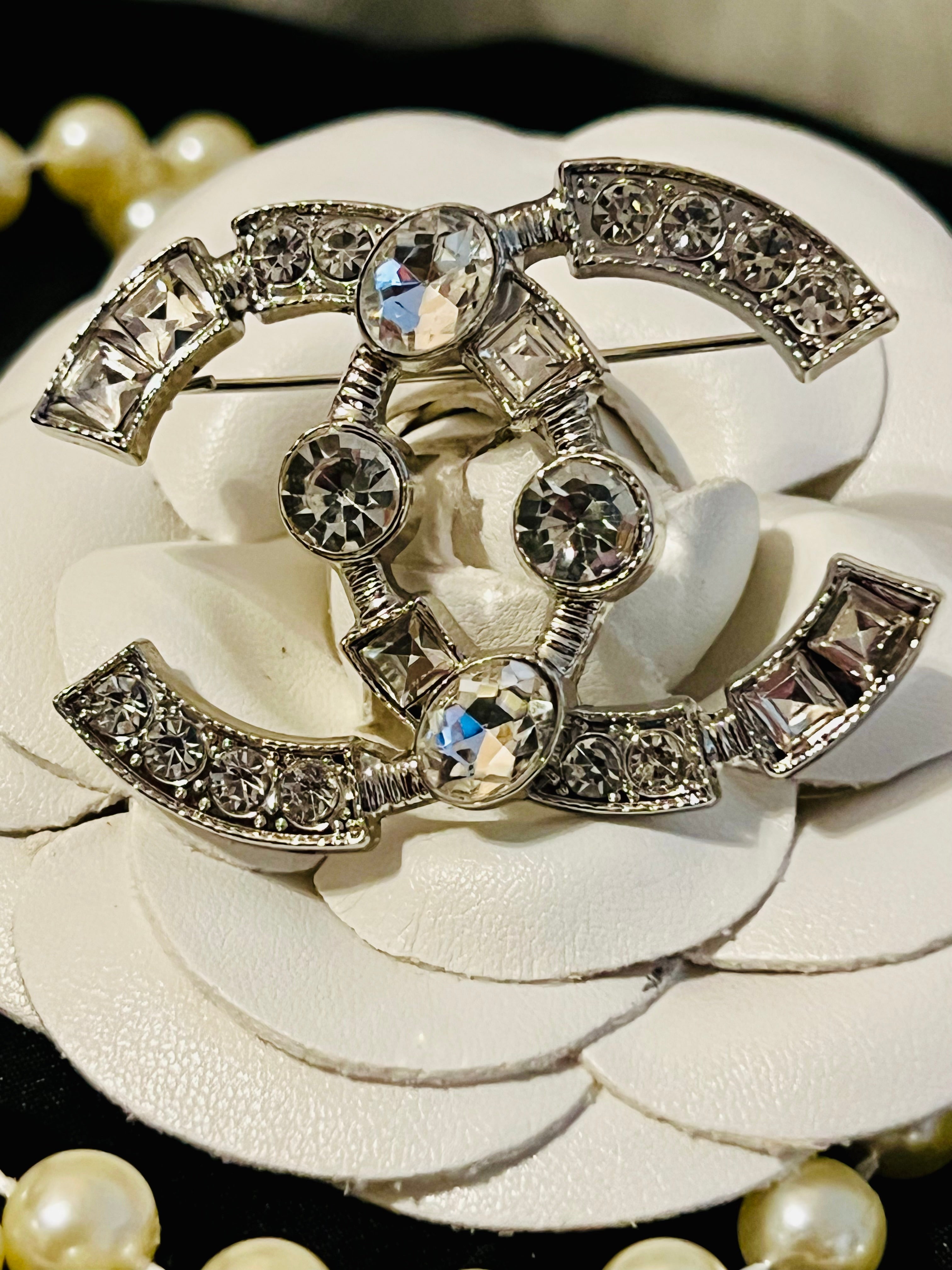 CHANEL Silver with Rhinestone Accent Brooch