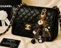 Chanel inspired black pearl bag charm-gold multi-charm with no 5 heart, camellia, bow-styled on classic flap