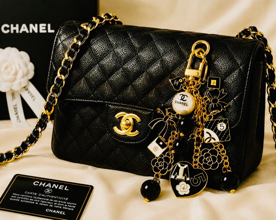 Chanel inspired black pearl bag charm-gold multi-charm with no 5 heart, camellia, bow-styled on classic flap