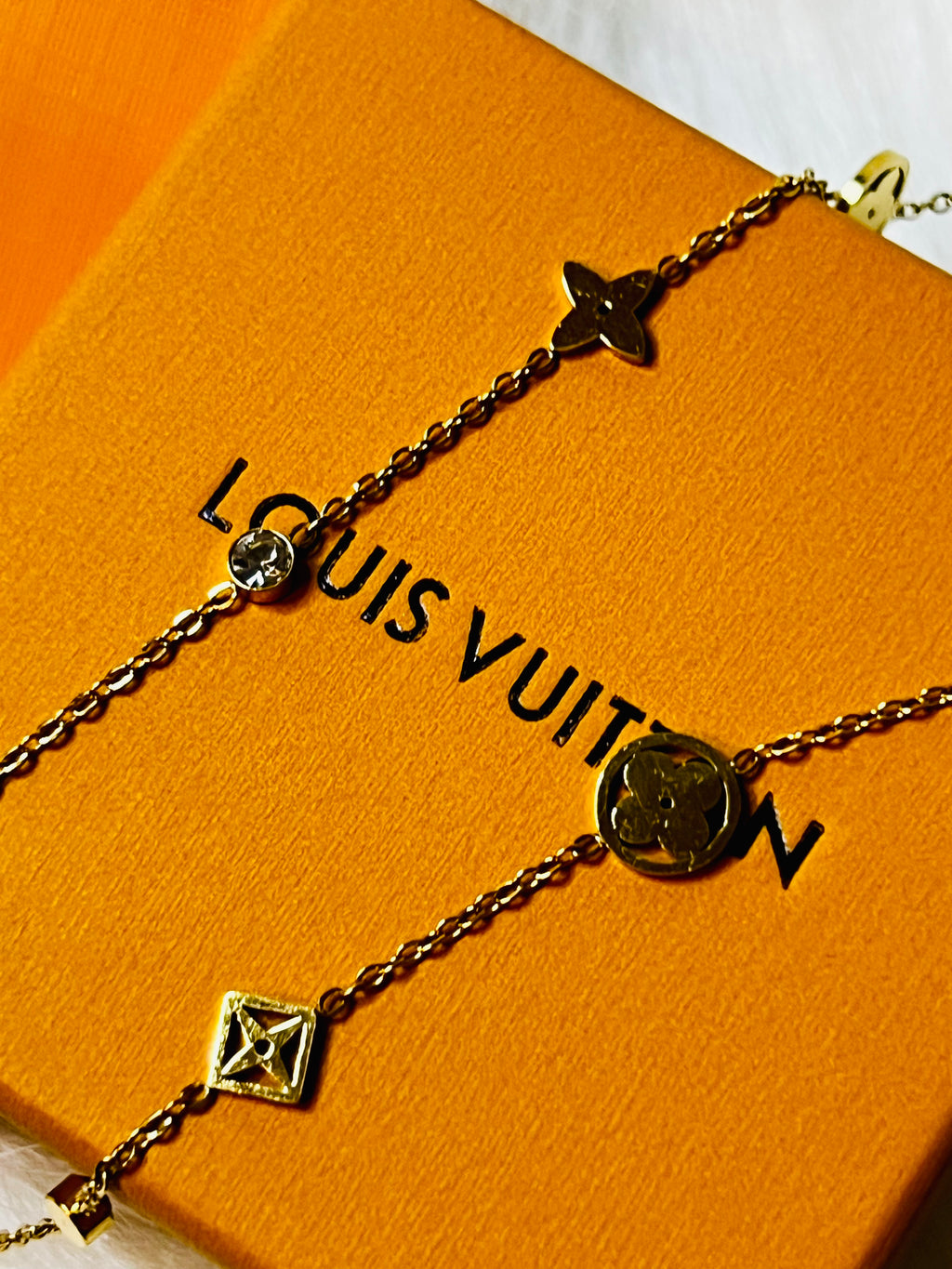 LV Gold Necklace with Crystal Accents and an Intricate Design