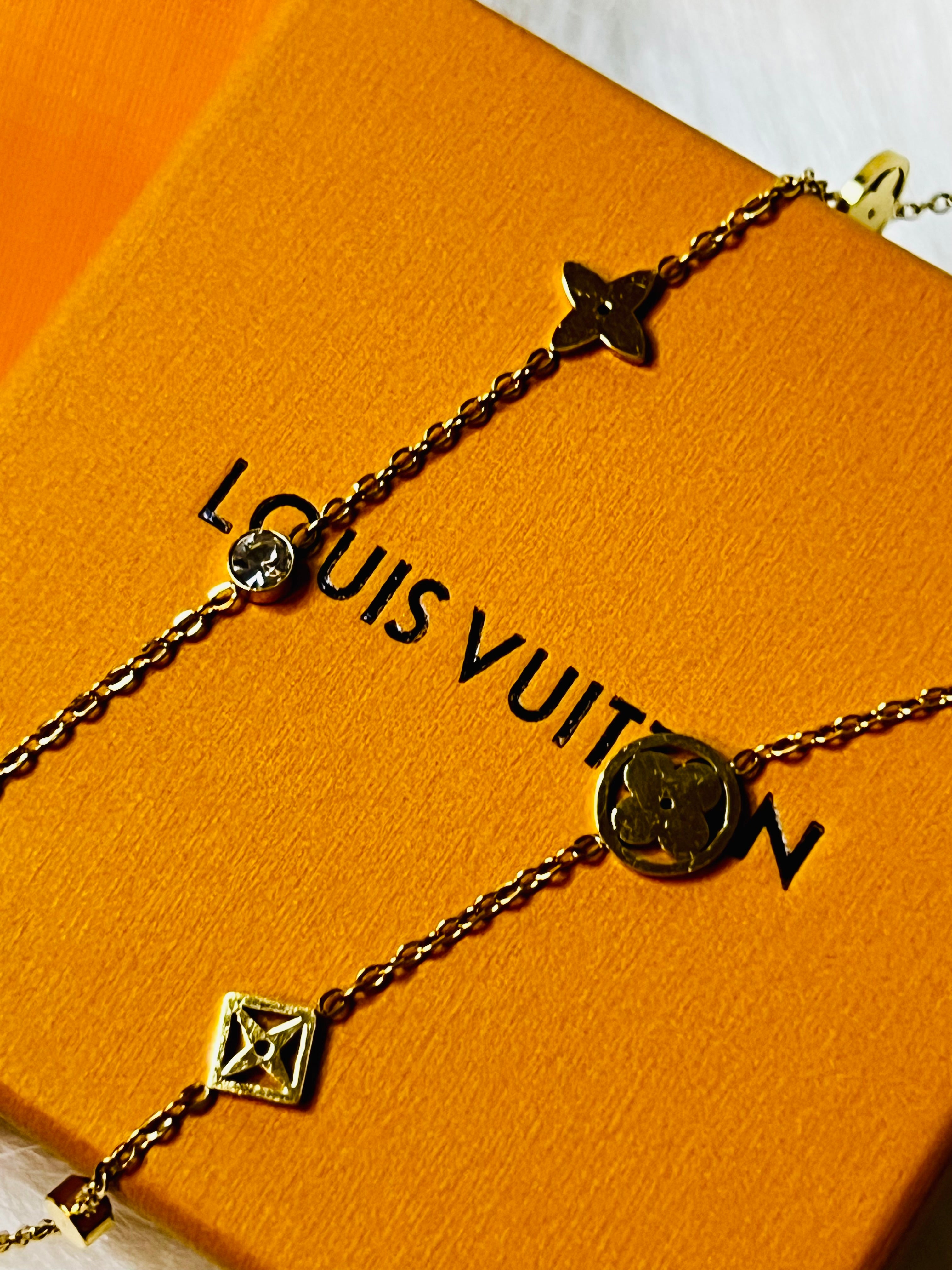 LV Gold Necklace with Crystal Accents and an Intricate Design