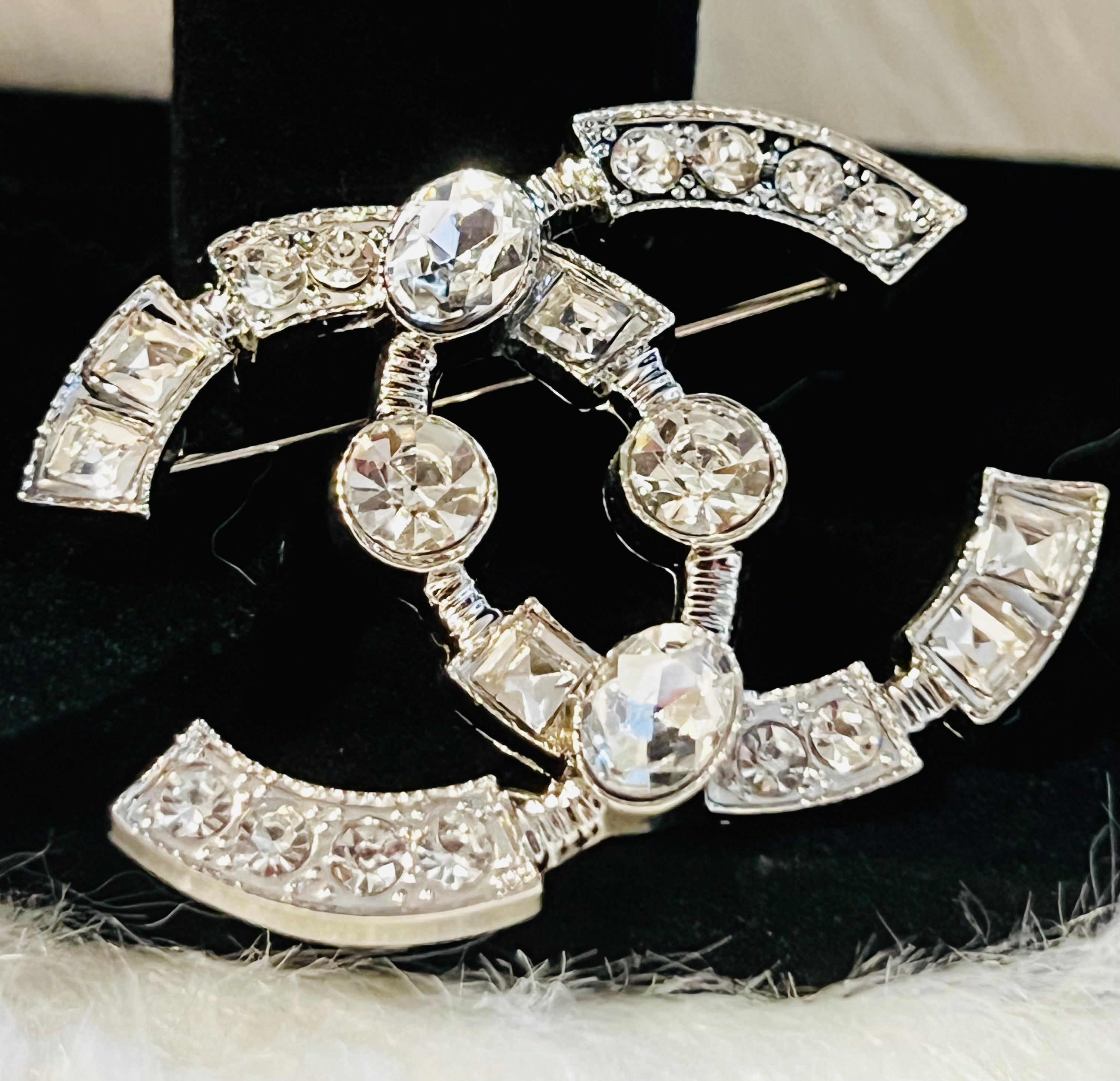 CHANEL Silver with Rhinestone Accent Brooch