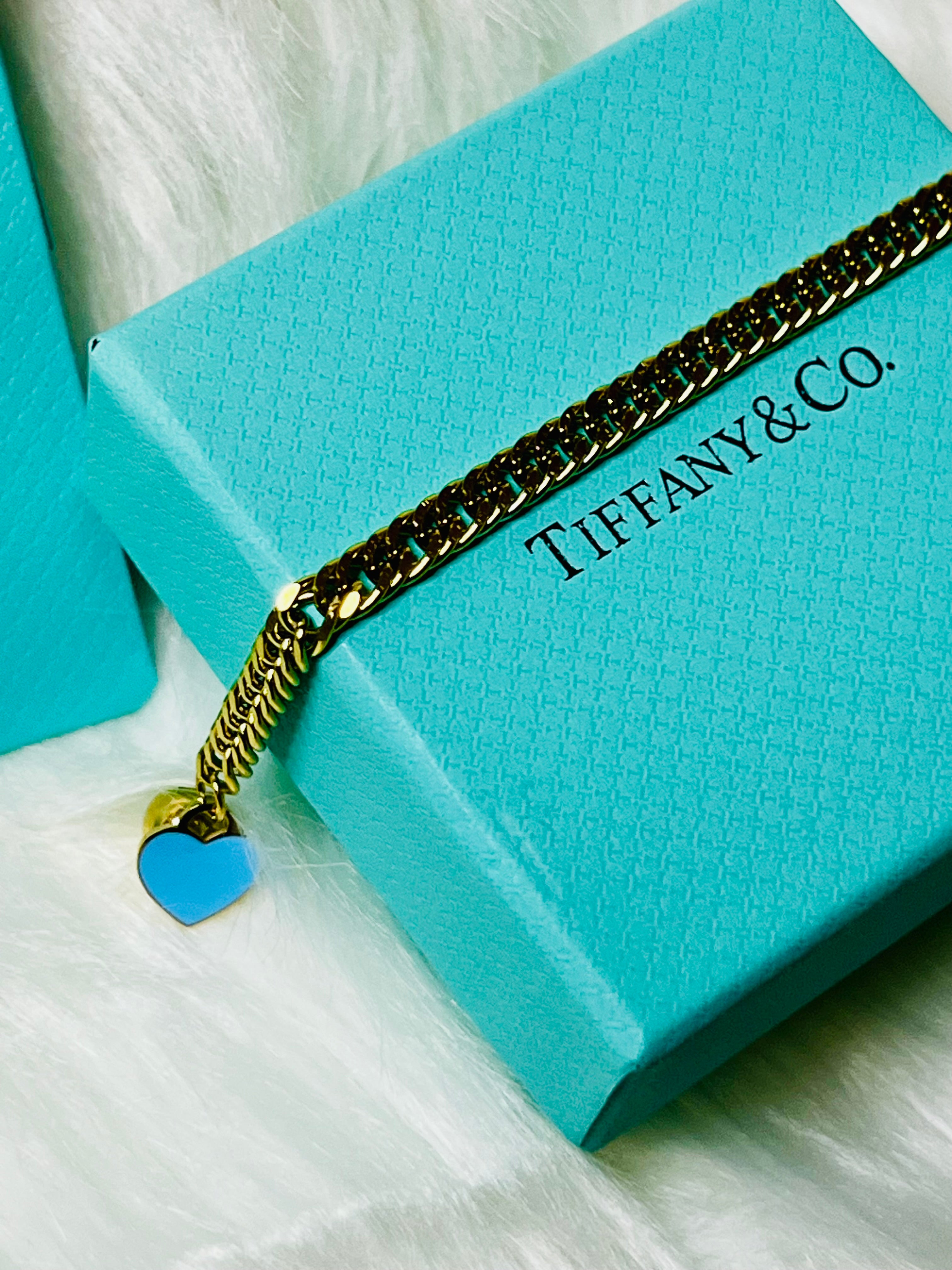 Tiffany & Co. Iconic Please Return to Tiffany Gold Woven Bracelet with Heart Shaped Blue & Gold Ball Dangle
