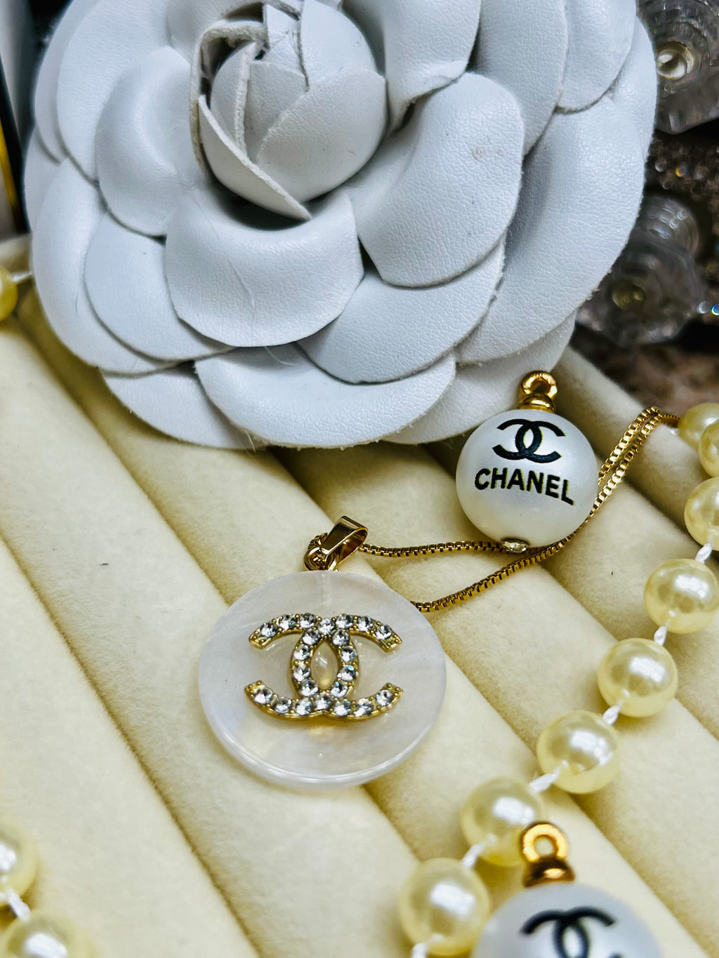 CHANEL White Shell with Gold Lettering Circular Pendant Necklace
