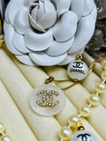 CHANEL White Shell with Gold Lettering Circular Pendant Necklace