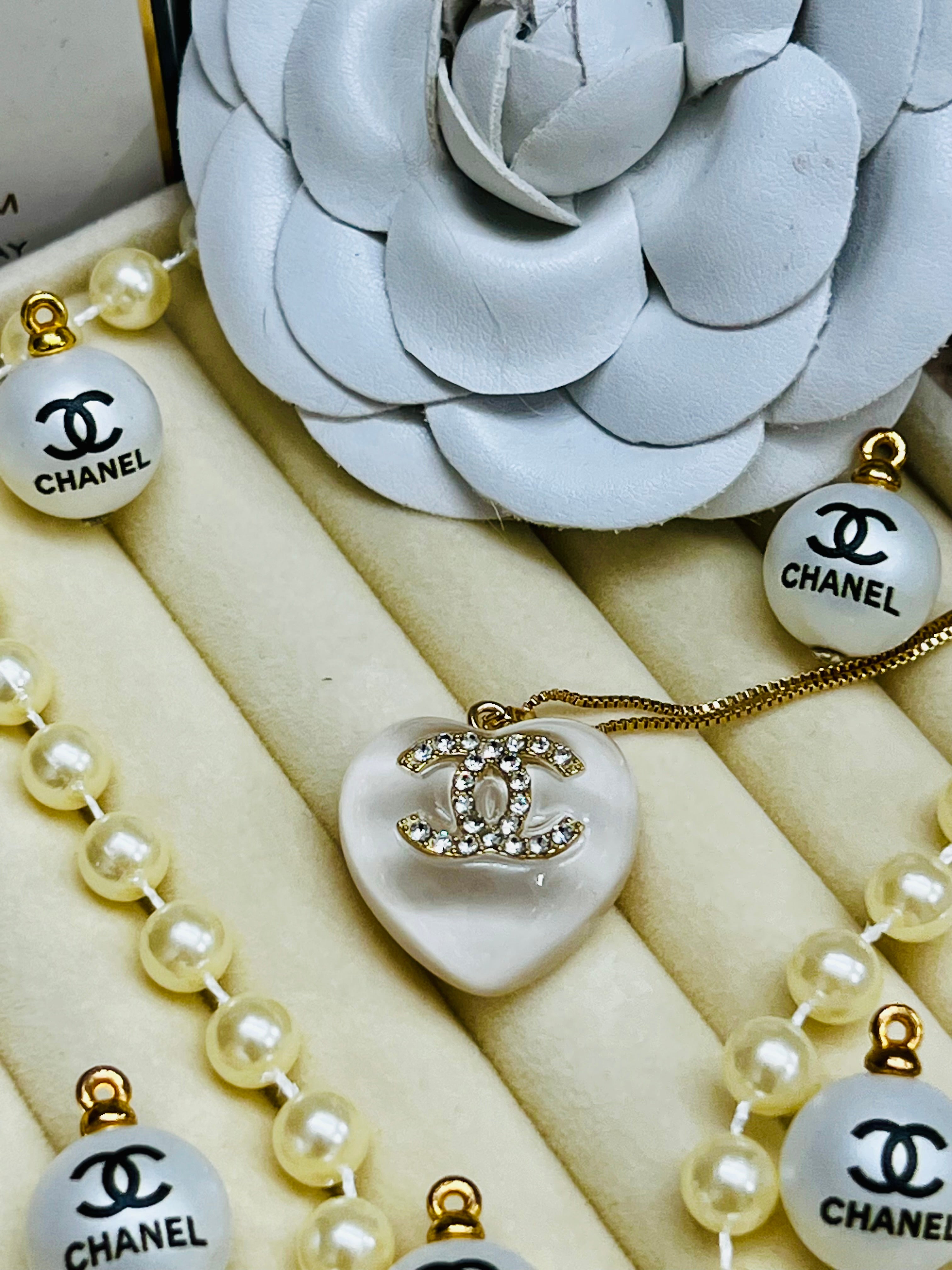 CHANEL White Stone with Gold Lettering Heart Pendant Necklace