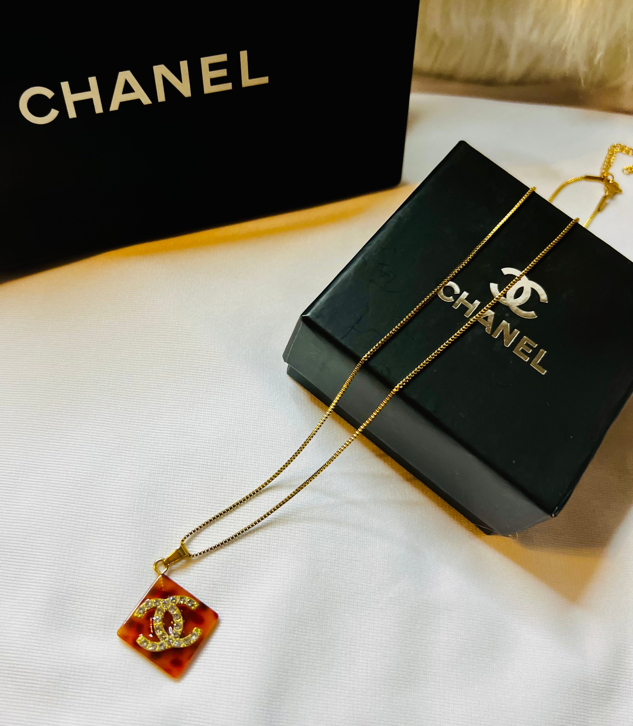 CHANEL Cheetah Print with Gold Lettering Diamond Pendant Necklace