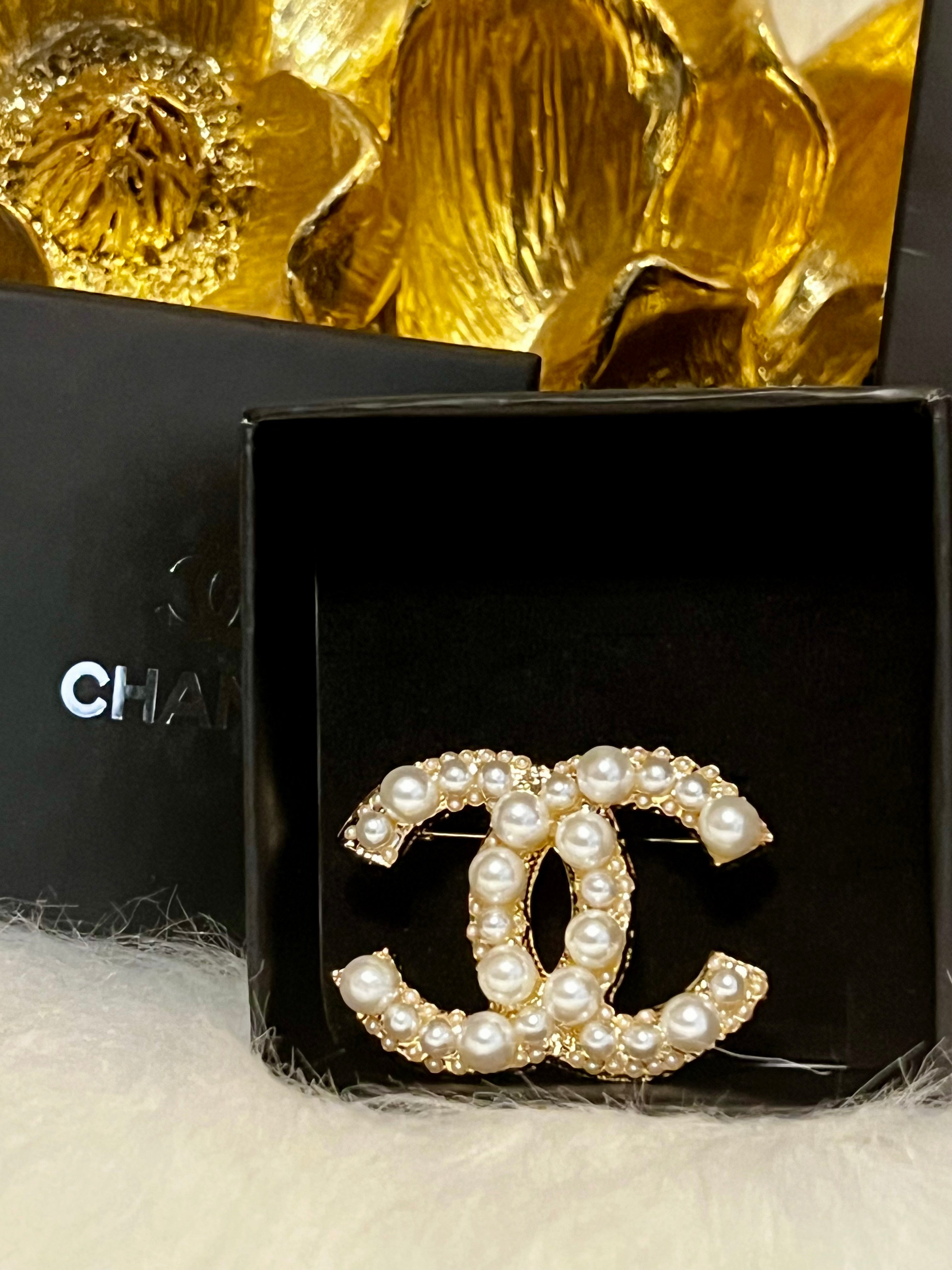 CHANEL Pearl Brooch Featuring Gold with Crystal Accents J