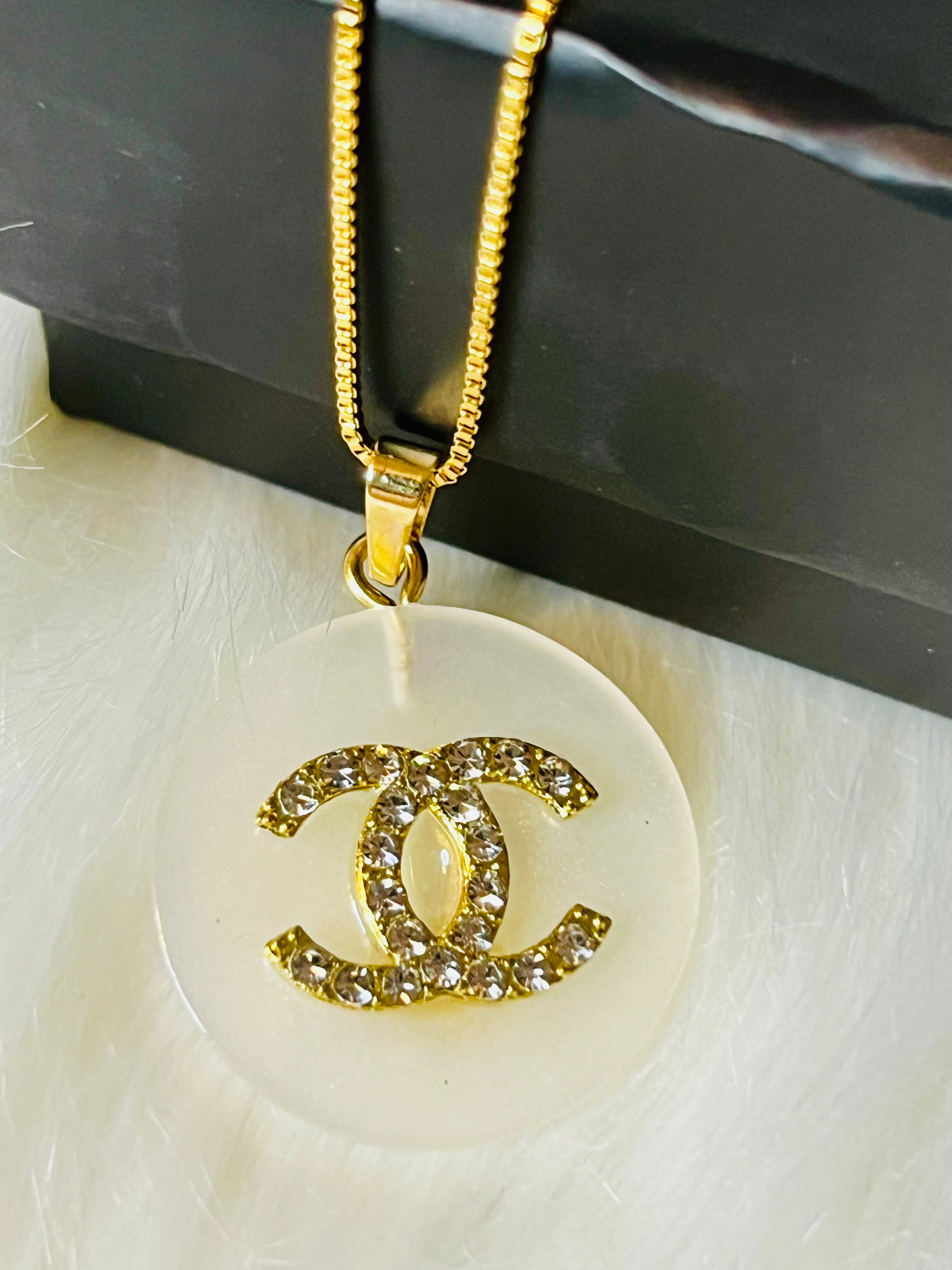 CHANEL White Shell with Gold Lettering Circular Pendant Necklace