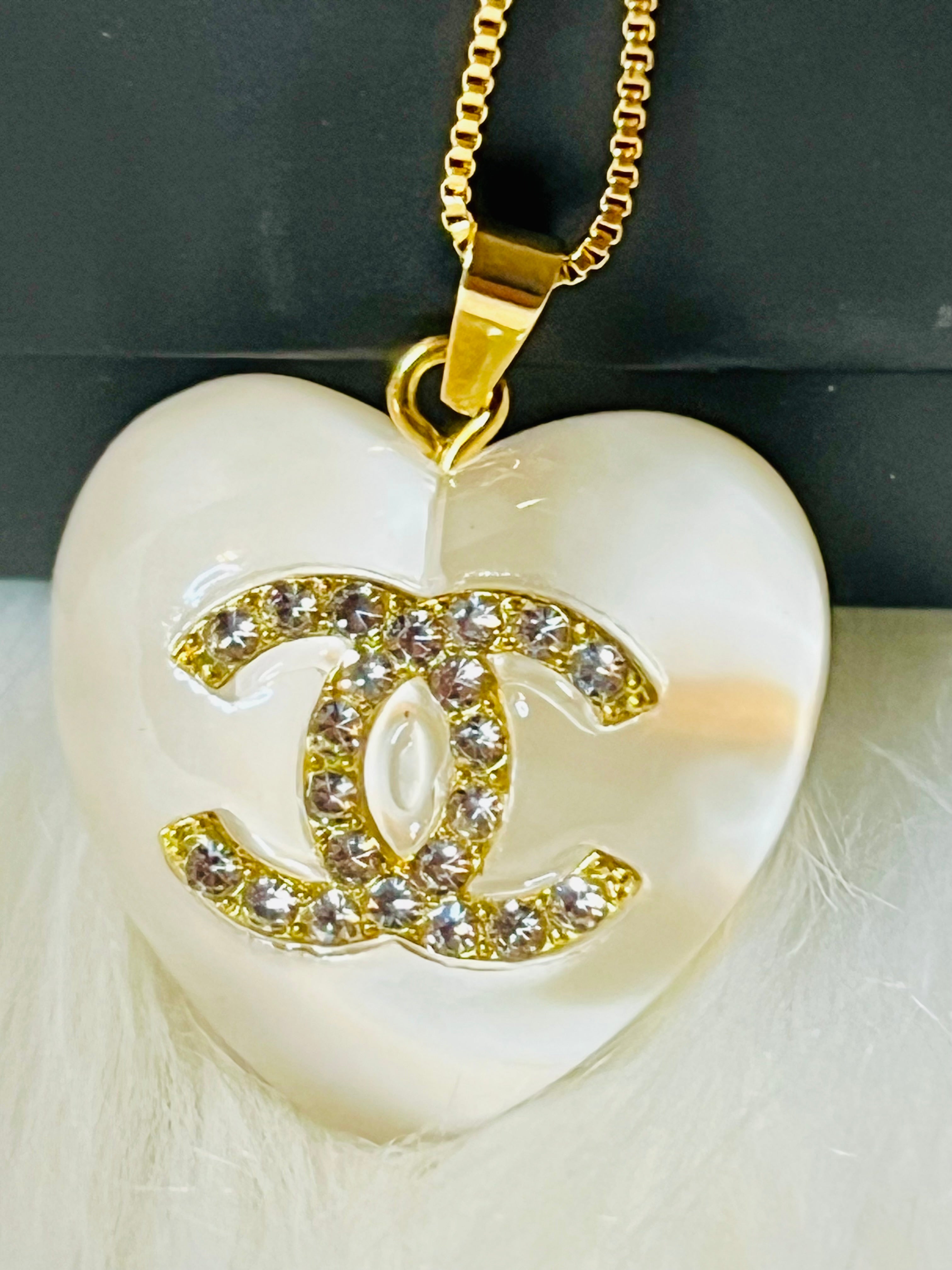 CHANEL White Stone with Gold Lettering Heart Pendant Necklace