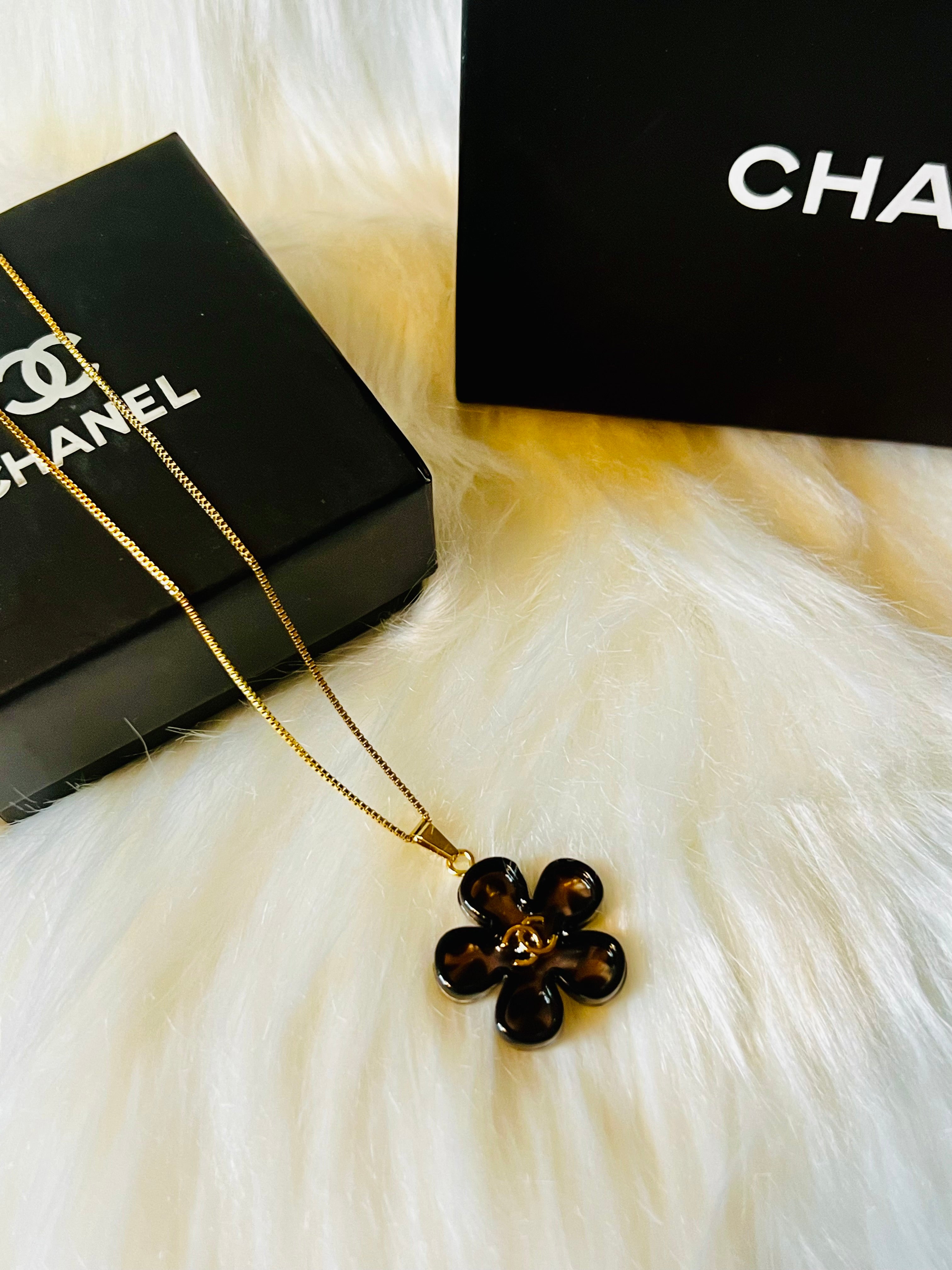 CHANEL Cheetah Print with Gold Lettering Flower Style Pendant Necklace