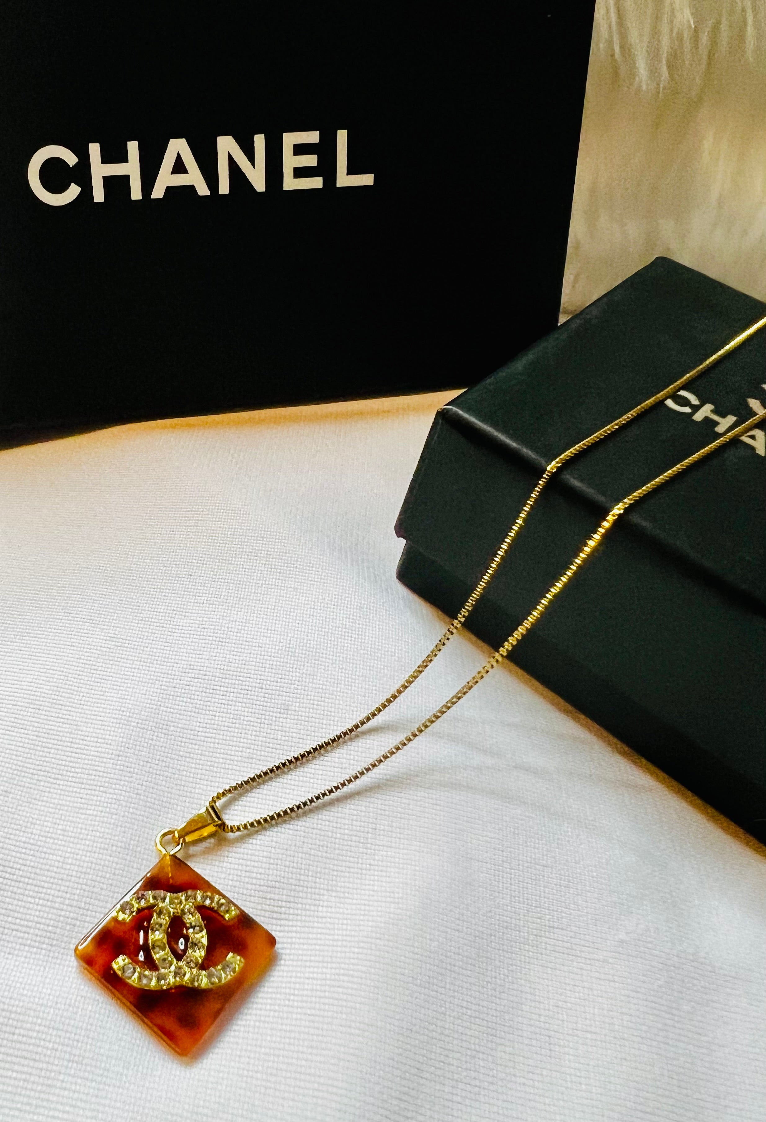 CHANEL Cheetah Print with Gold Lettering Diamond Pendant Necklace