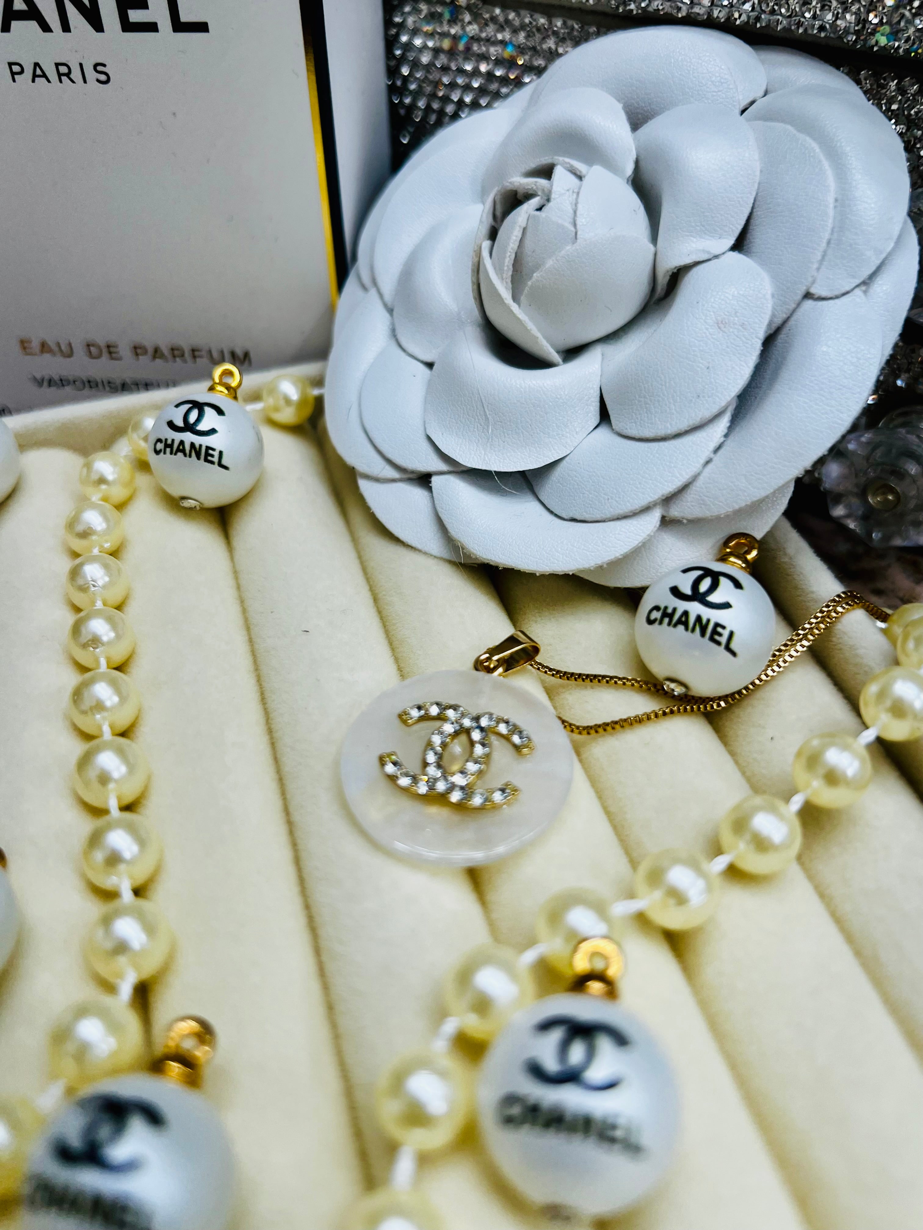 CHANEL White Shell with Gold Lettering Circular Pendant Necklace