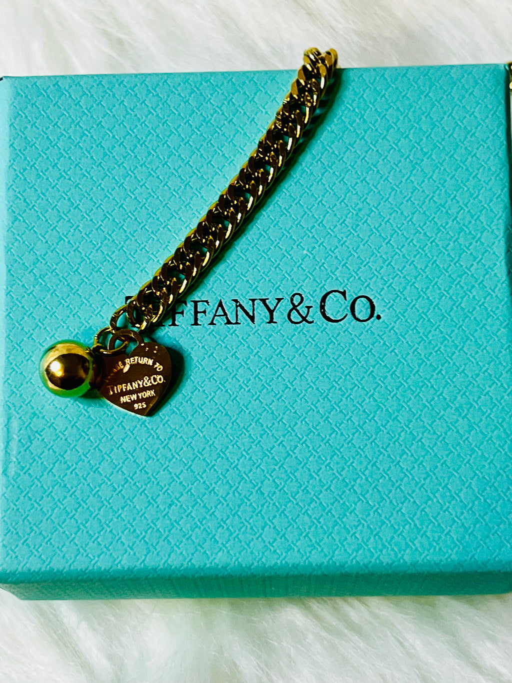 Tiffany & Co. Iconic Please Return to Tiffany Gold Woven Bracelet with Heart Shaped Blue & Gold Ball Dangle