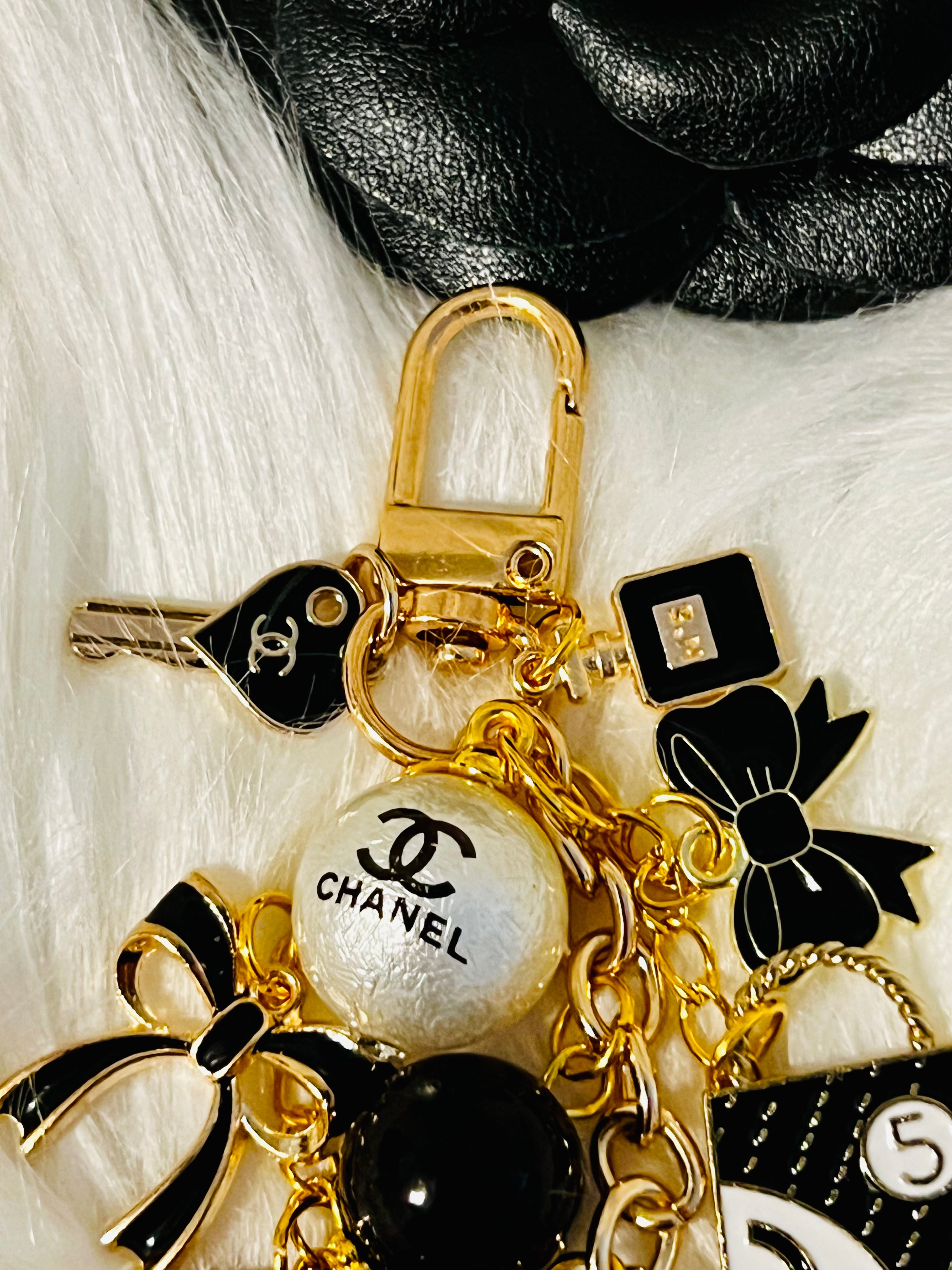 Chanel inspired black pearl bag charm-gold multi-charm with no 5 heart, camellia, bow-styled on classic flap