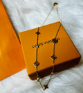 LV Gold Necklace with Crystal Accents and an Intricate Design