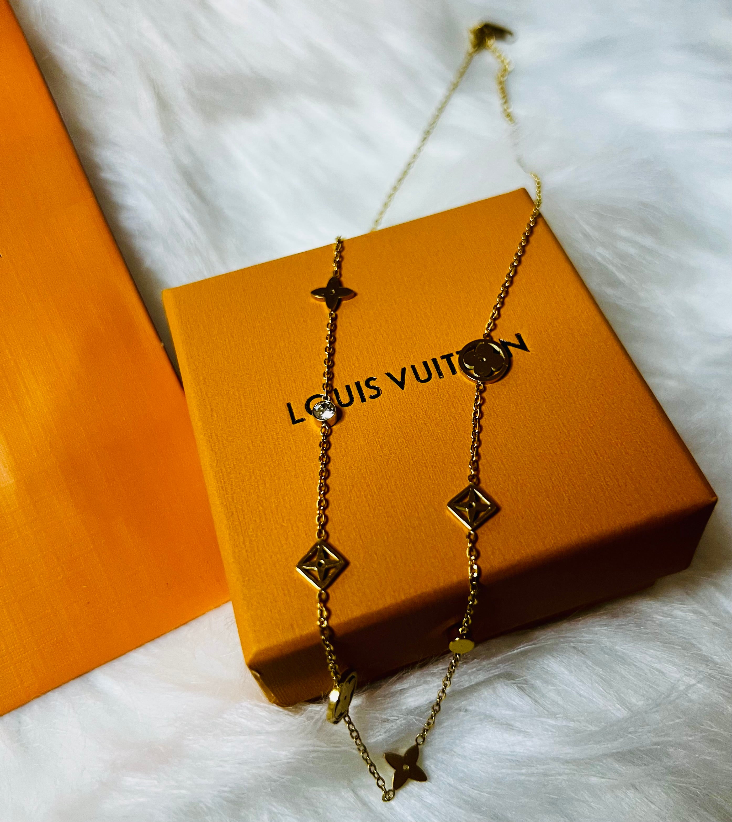 LV Gold Necklace with Crystal Accents and an Intricate Design