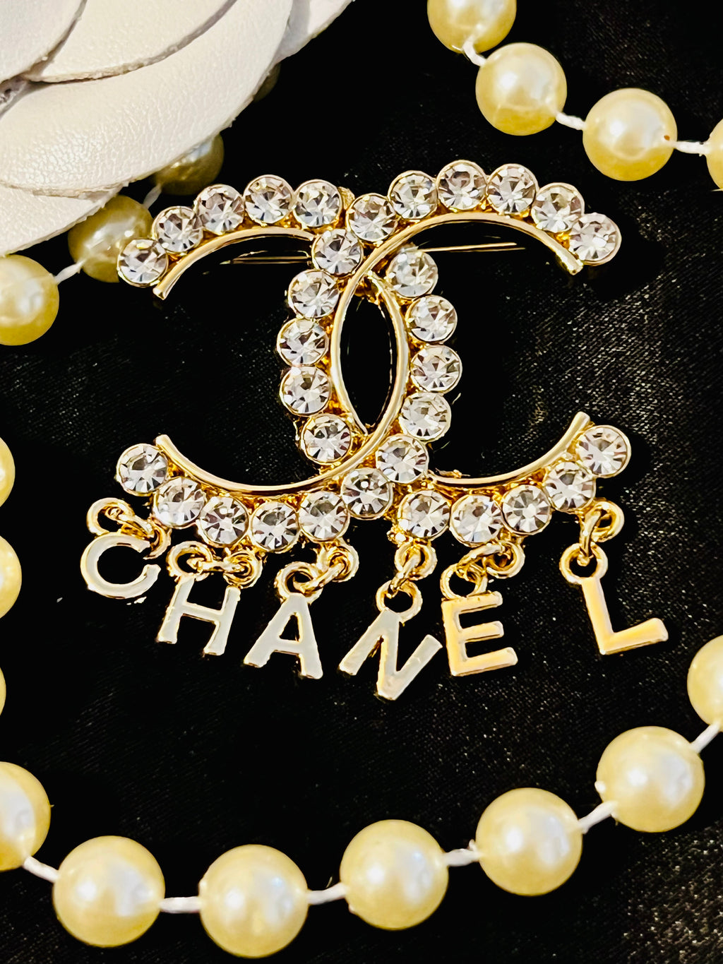 CHANEL Unique Brooch Featuring Gold Crystal Accents with Iconic Drop Logo A