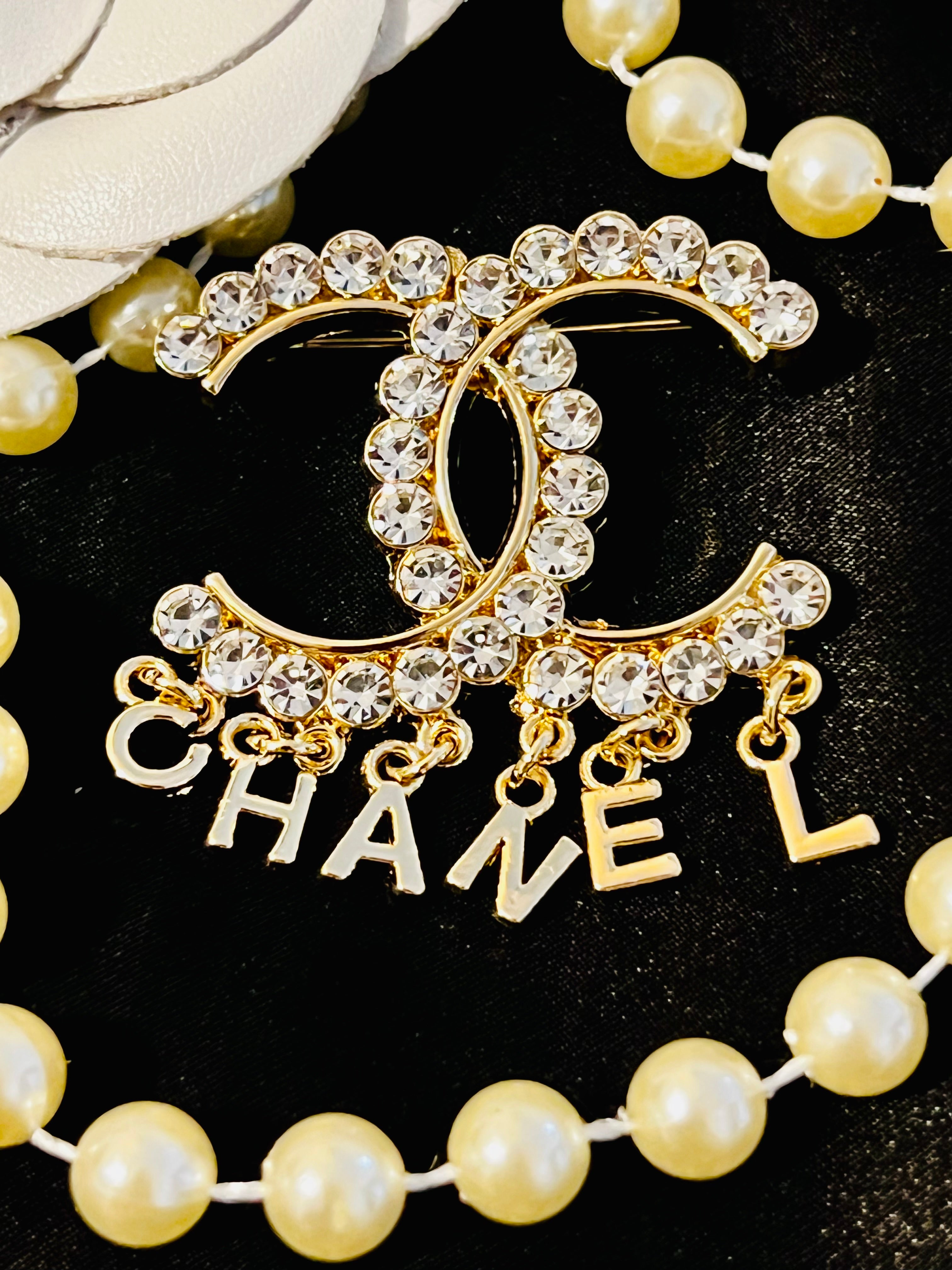 CHANEL Unique Brooch Featuring Gold Crystal Accents with Iconic Drop Logo A
