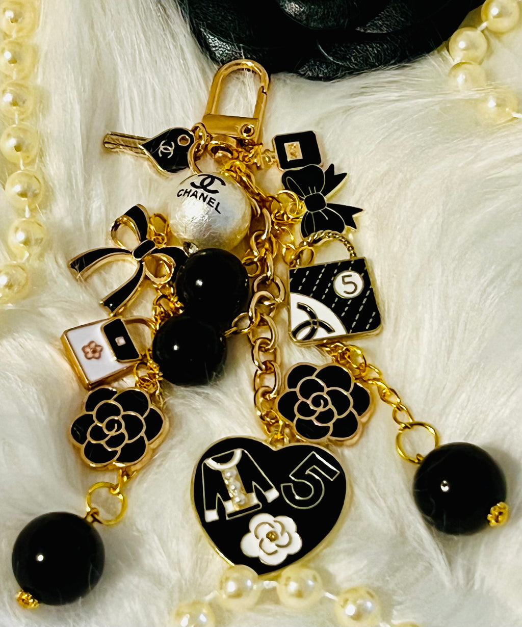 Chanel inspired black pearl bag charm-gold multi-charm with no 5 heart, camellia, bow-styled on classic flap