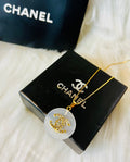 CHANEL White Shell with Gold Lettering Circular Pendant Necklace